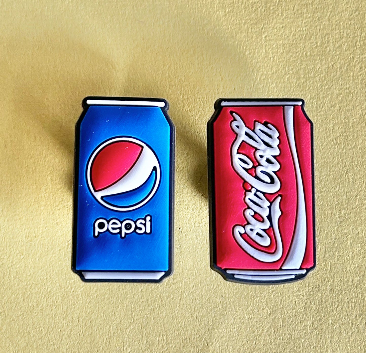 Blue and Red brown fizzy drink can shoe charms.