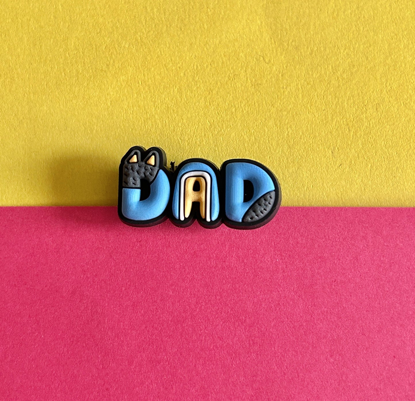 Dad croc like shoe charm.