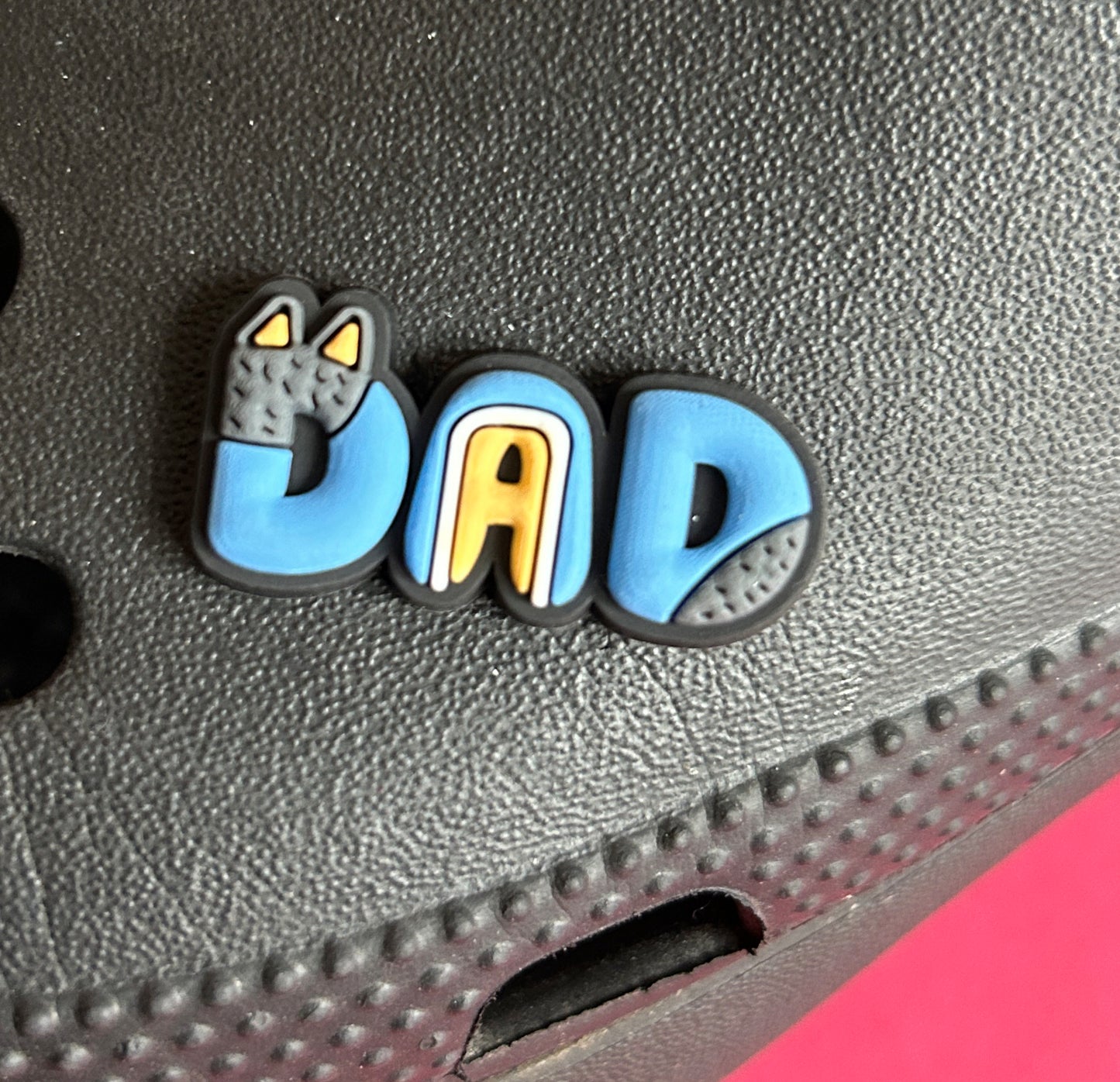 Dad croc like shoe charm.