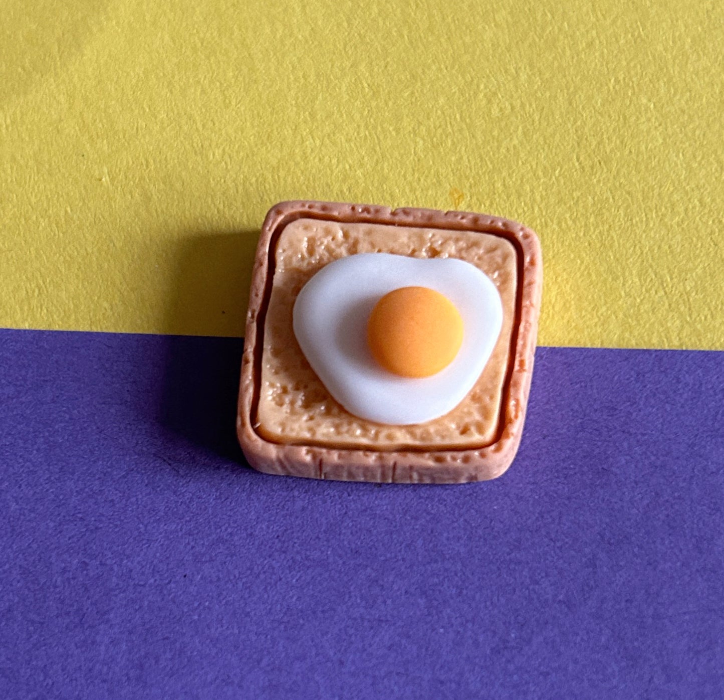 Resin egg on toast shoe charm.