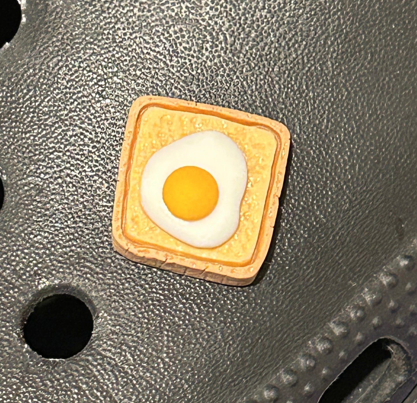 Resin egg on toast shoe charm.
