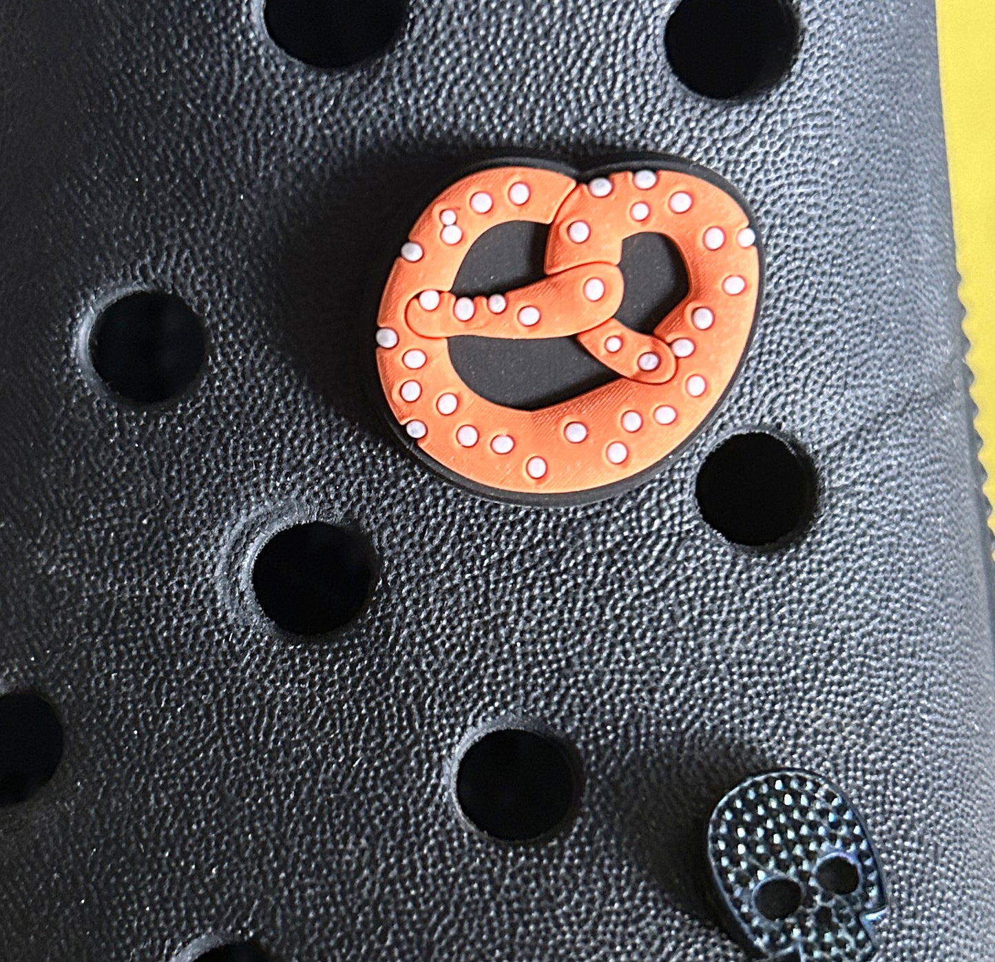 Pretzel croc like shoe charm.