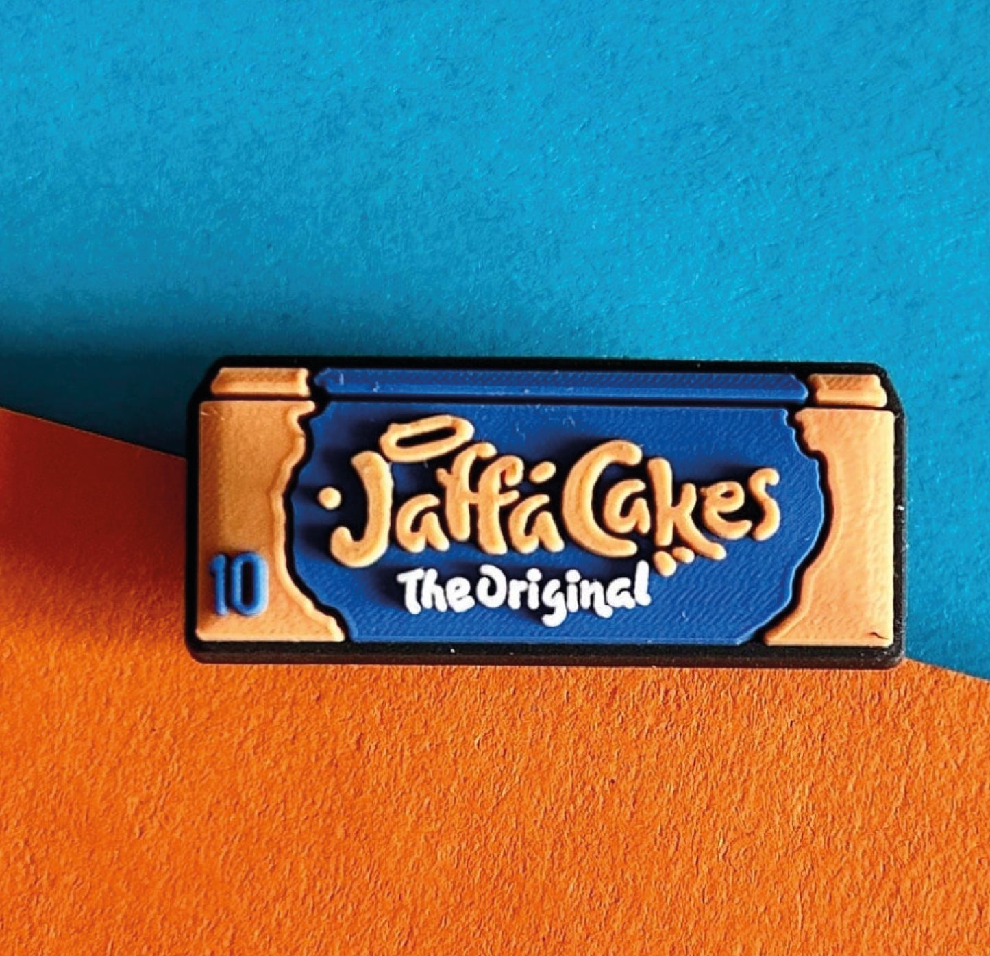 In the style of jaffa cakes croc shoe charm.