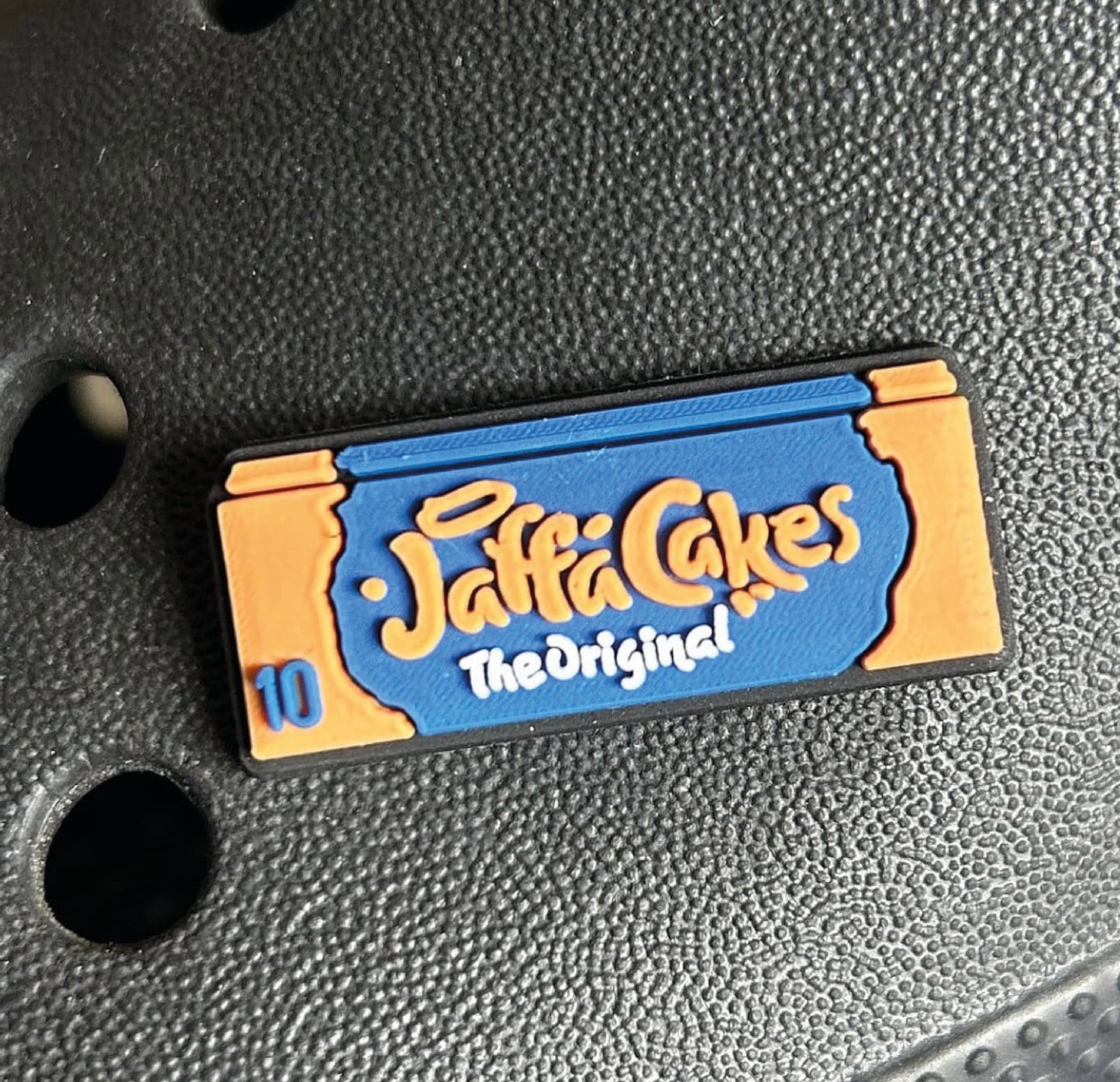 In the style of jaffa cakes croc shoe charm.