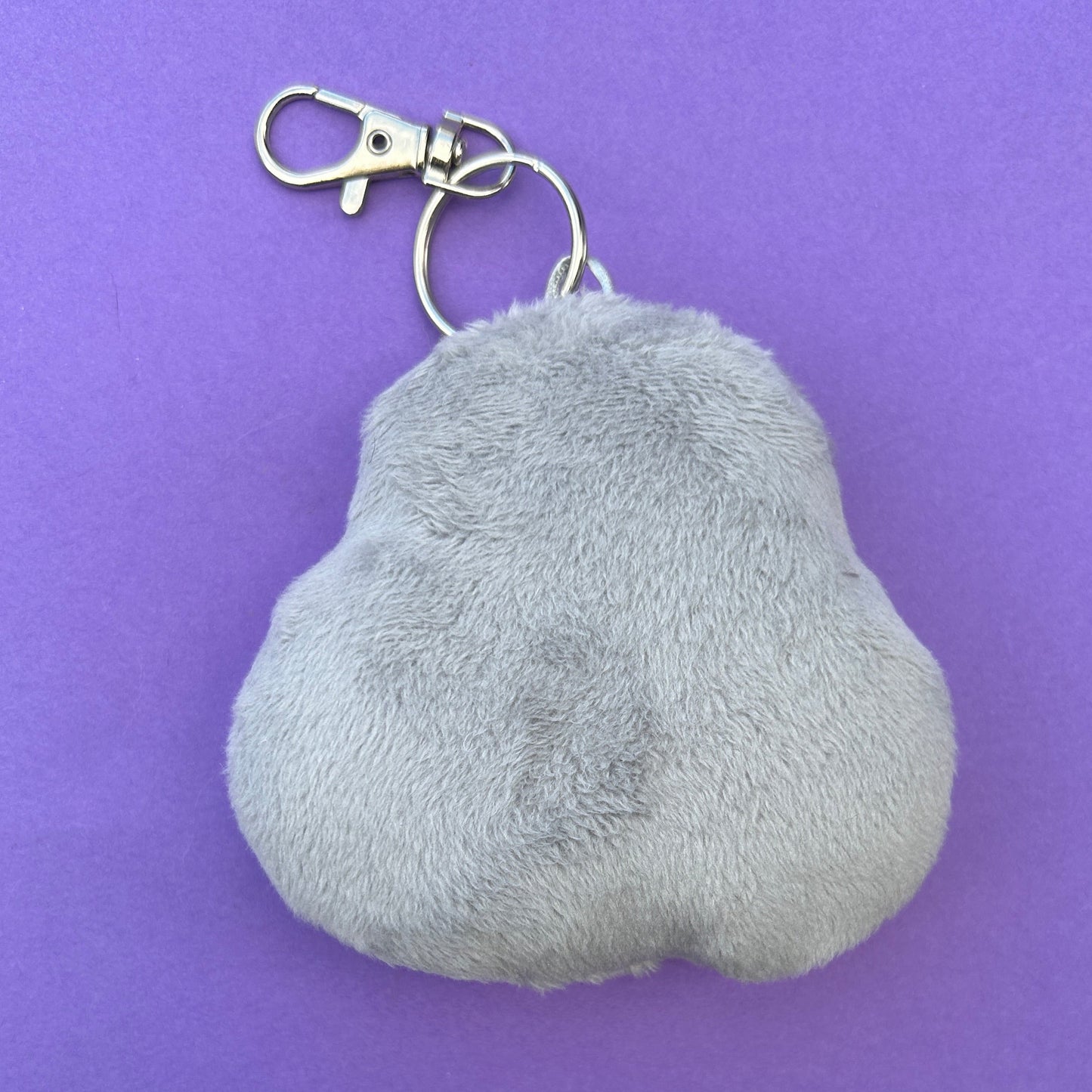 Unique chubby pigeon plush bag charm made from minky fabric. Back view.