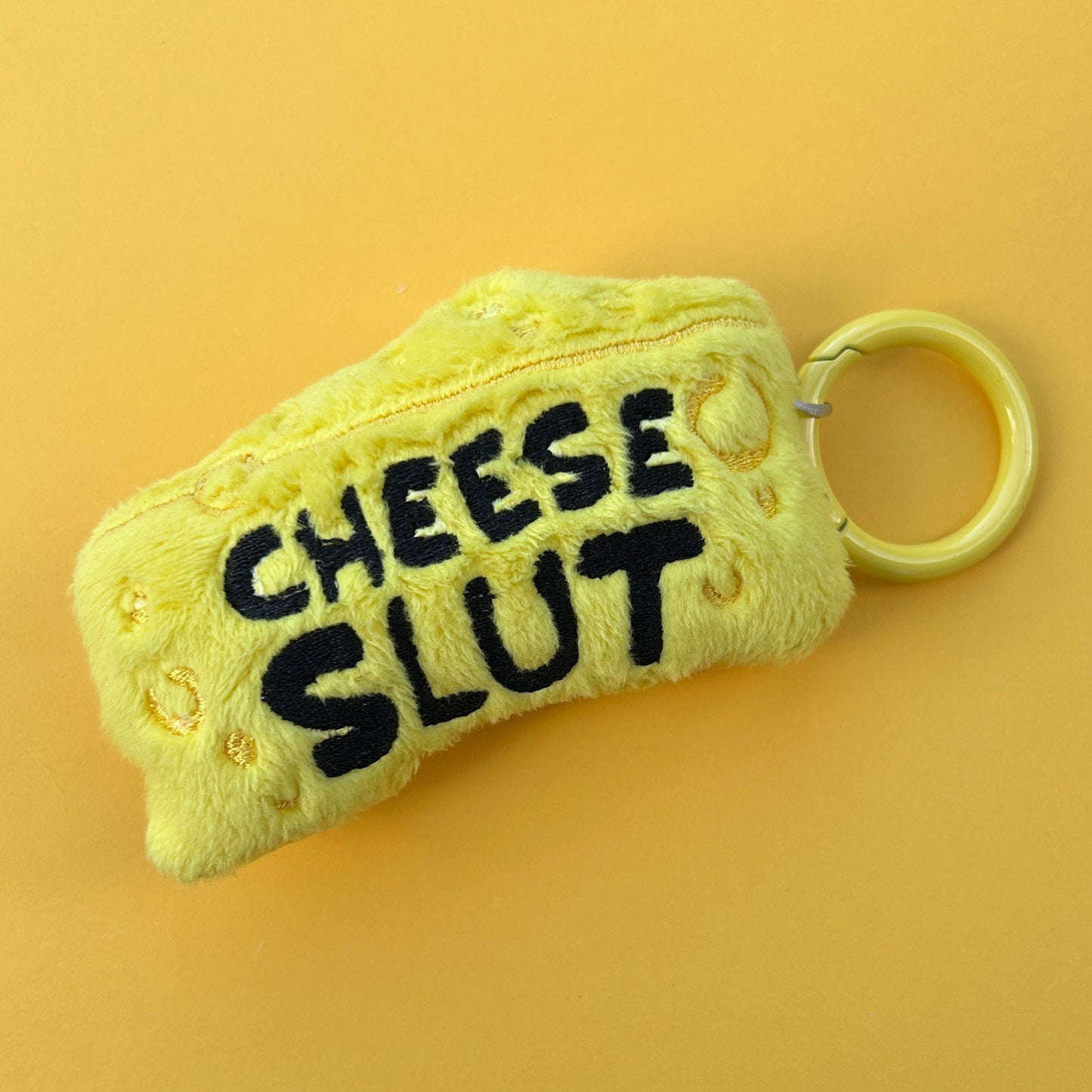 Handmade Cheese Slut plush keyring wedge design.