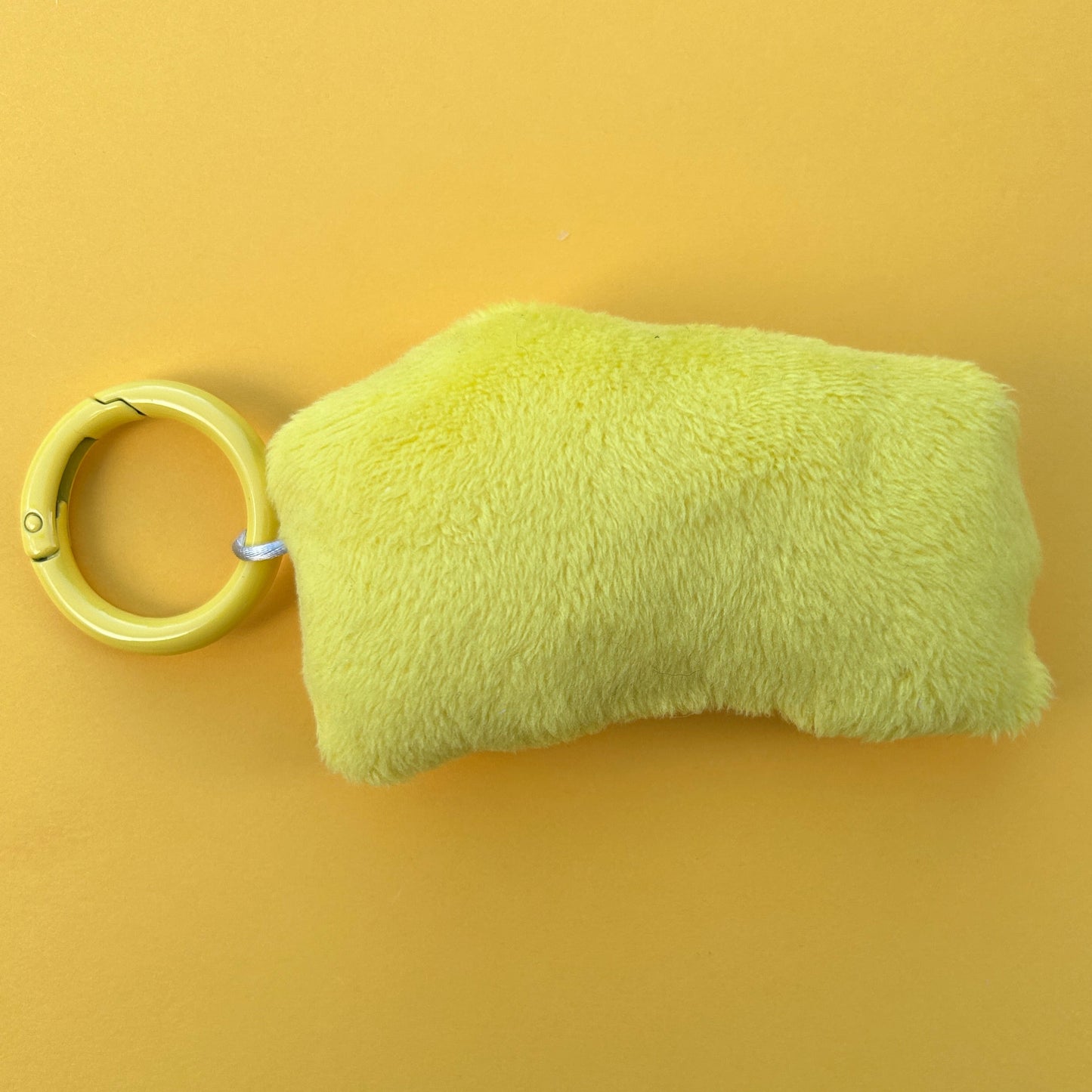 Unique handmade wedge of cheese plush keyring. Back view.
