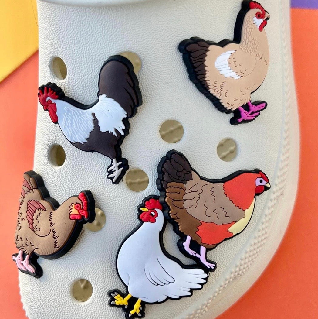 Various Chickens PVC shoe charm waterproof clog accessory shown on a cream clog croc shoe.