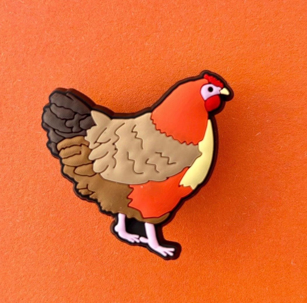 Novelty chicken shoe charm for Croc style shoes.