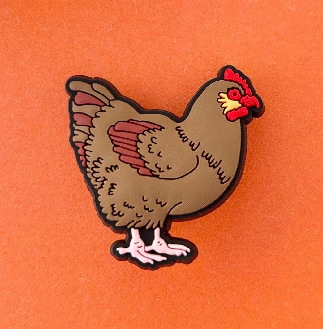 Novelty chicken shoe charm for Croc style shoes.