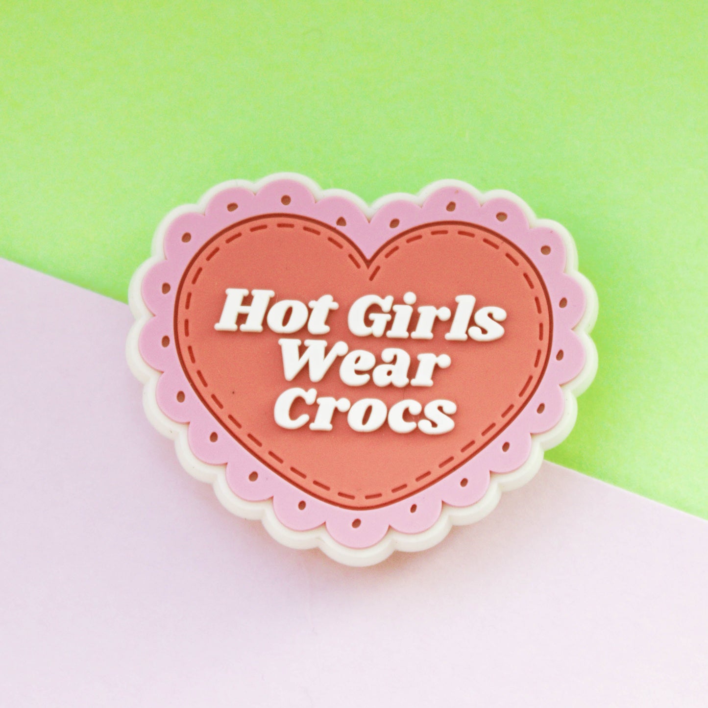 Hot girls wear crocs pink shoe charm. Scalloped around the edge. Rubber material.