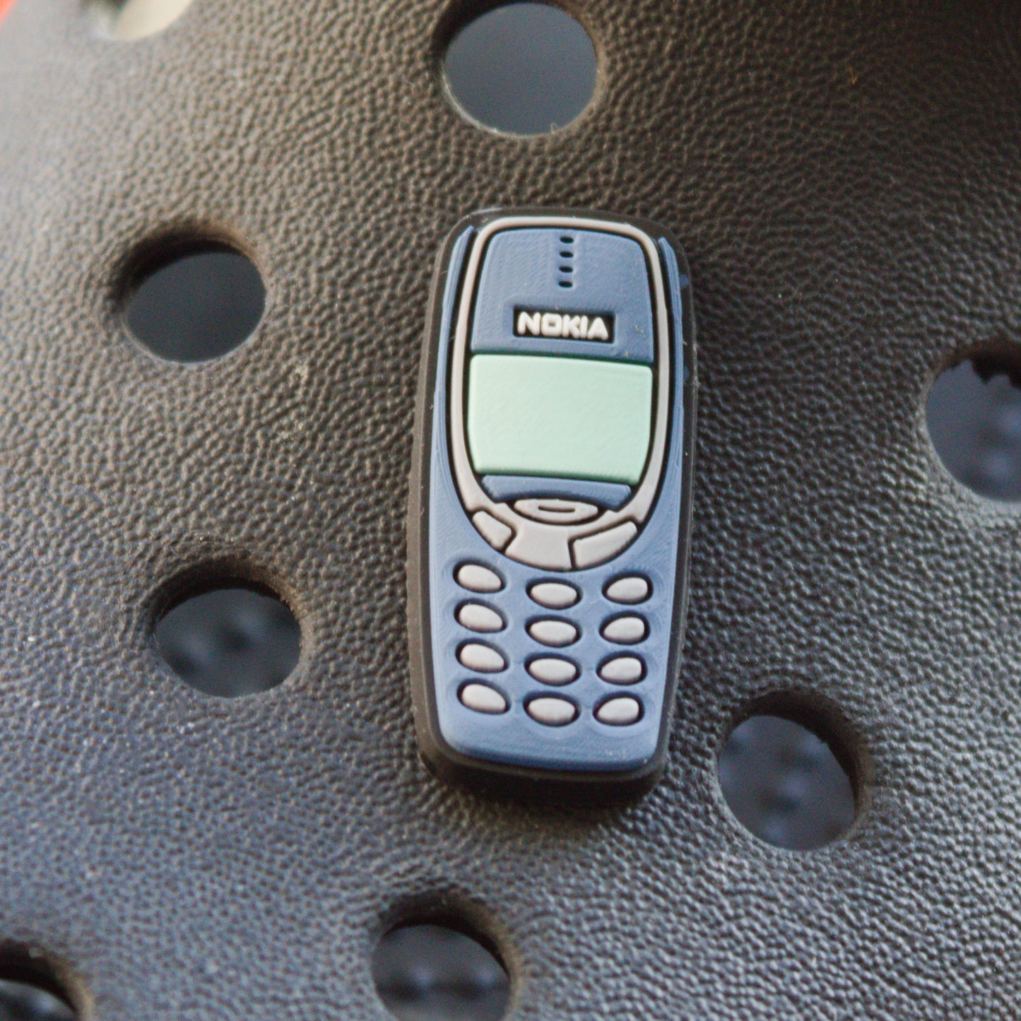 90's 3310 Mobile Phone croc like shoe charm. Shown on a black croc shoe.