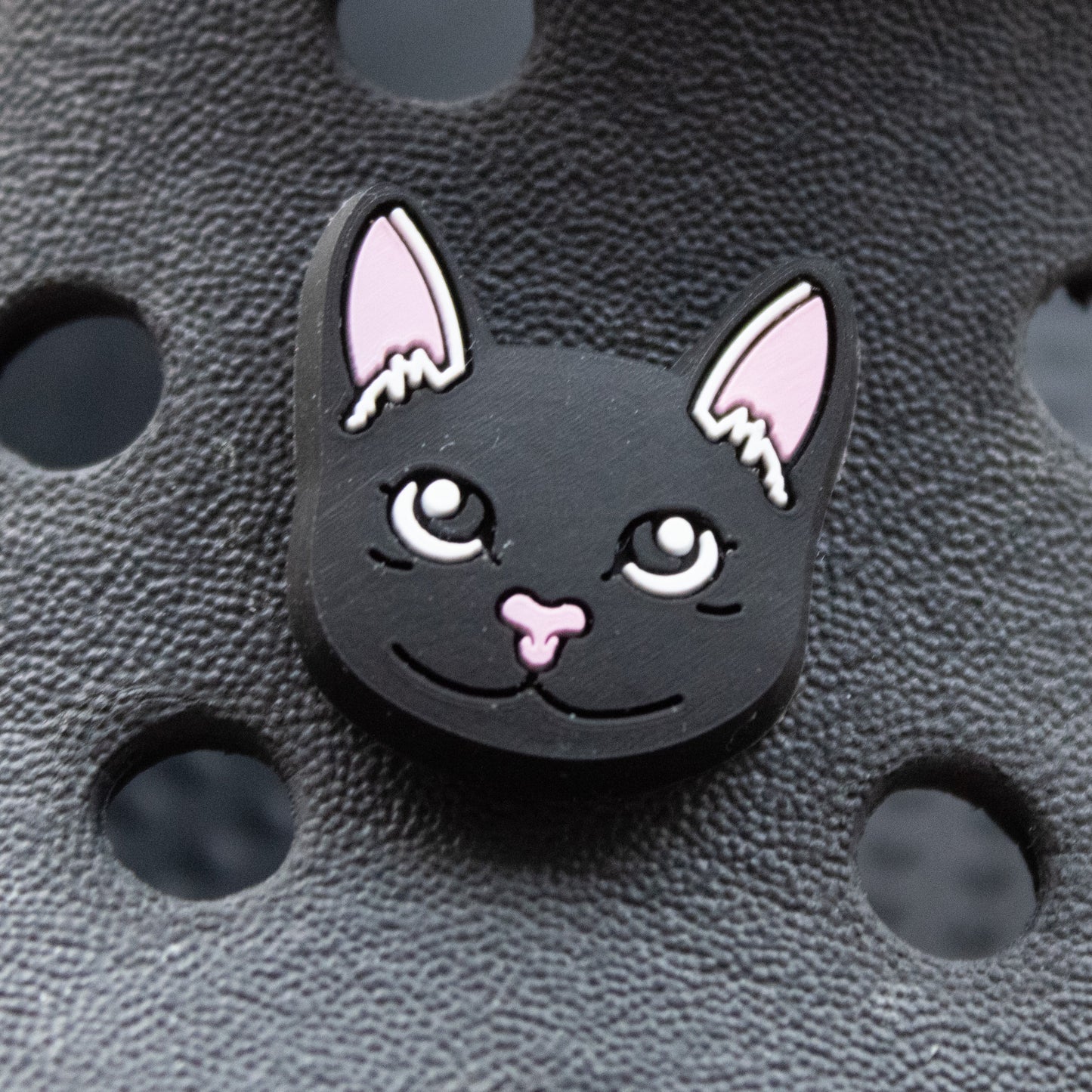 Black Cat Face croc like shoe charm. Shown on a black croc shoe.