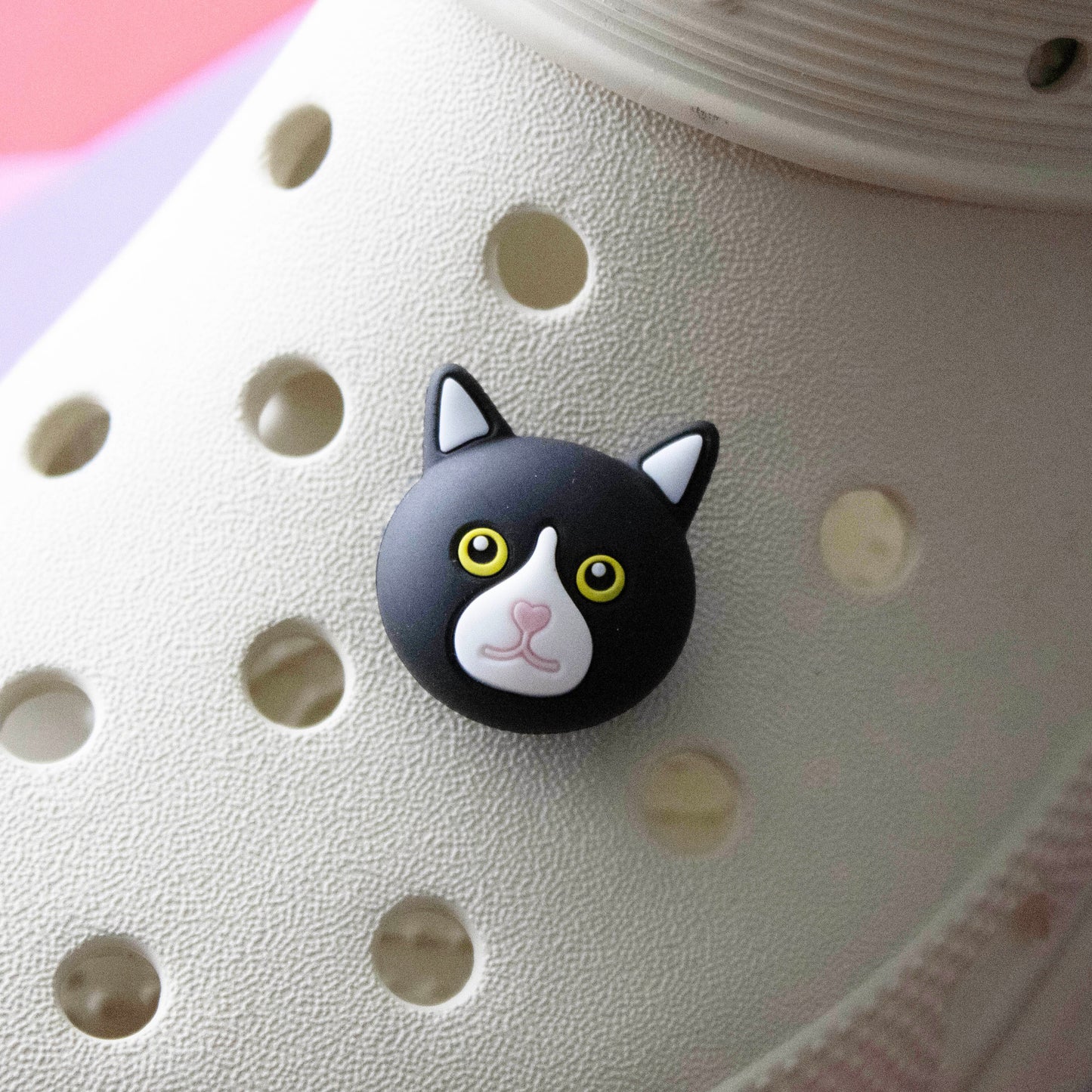 Black cat face 3D croc like shoe charm. Premium quality. Modelled on a cream croc shoe.