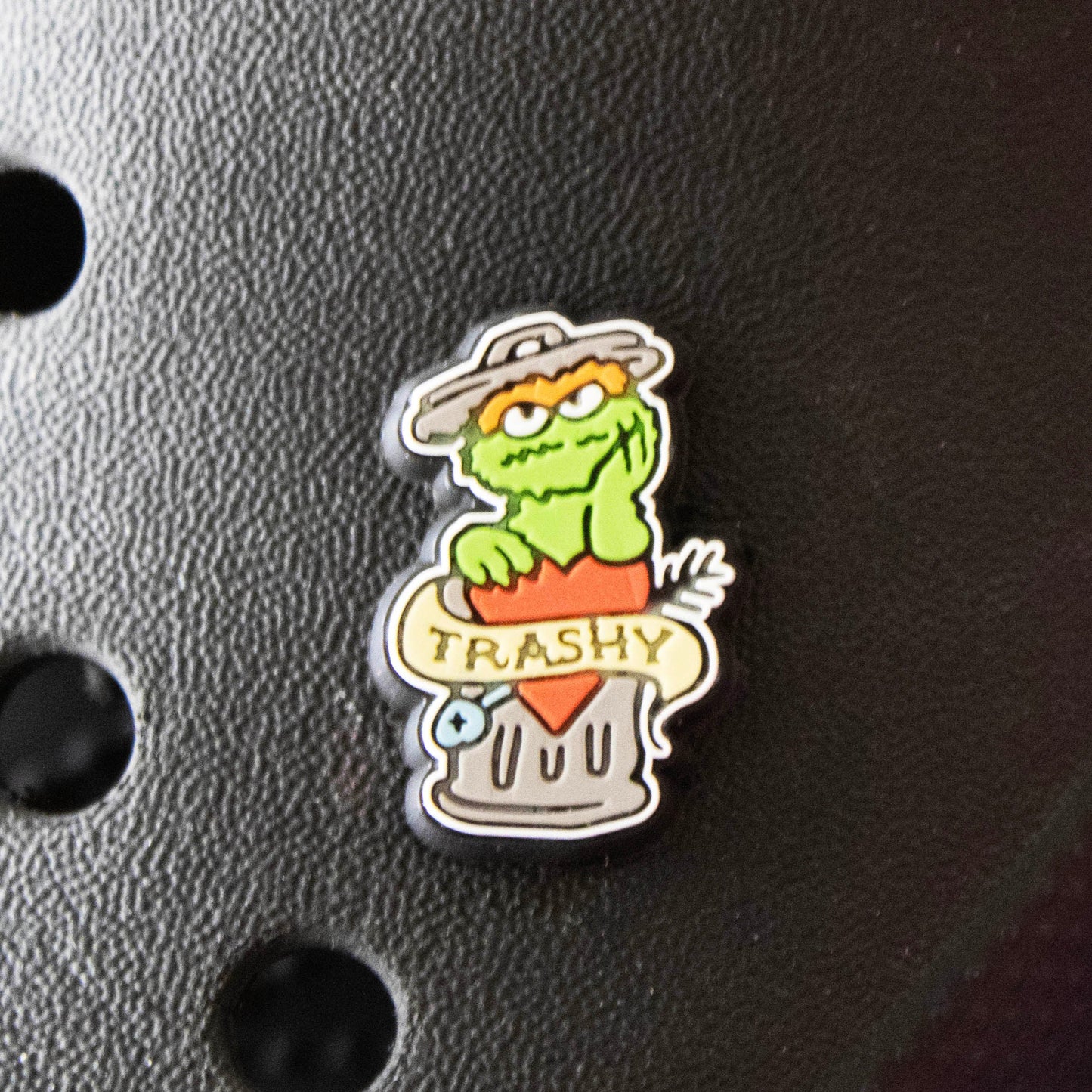 Trashy Tattoo look croc like shoe charm. Shown on a black croc shoe.