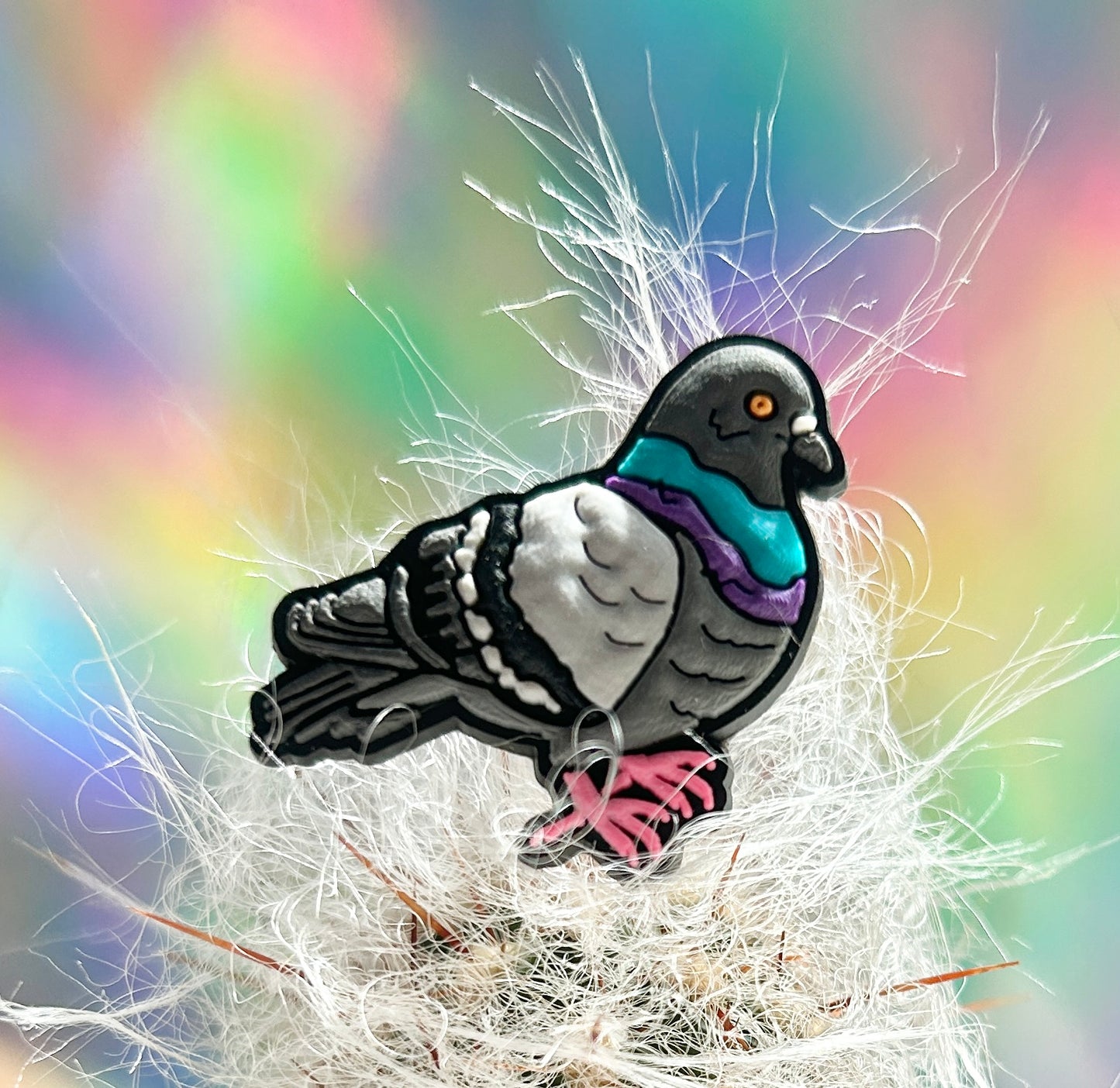 Pigeon croc charm sat on a cactus.
