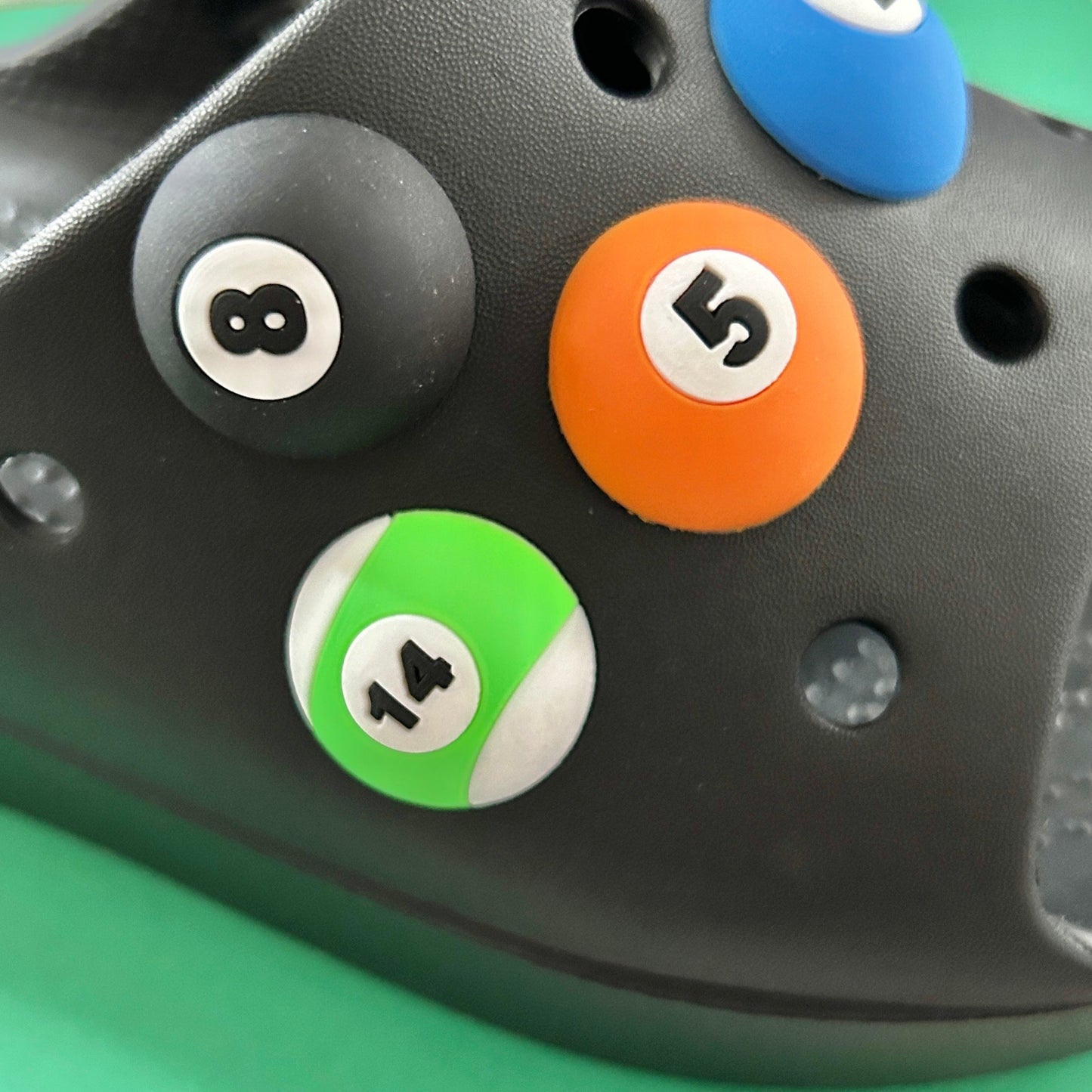 Spots and Stripes 3D Pool Balls croc like shoe charm. Shown on a black croc shoe.