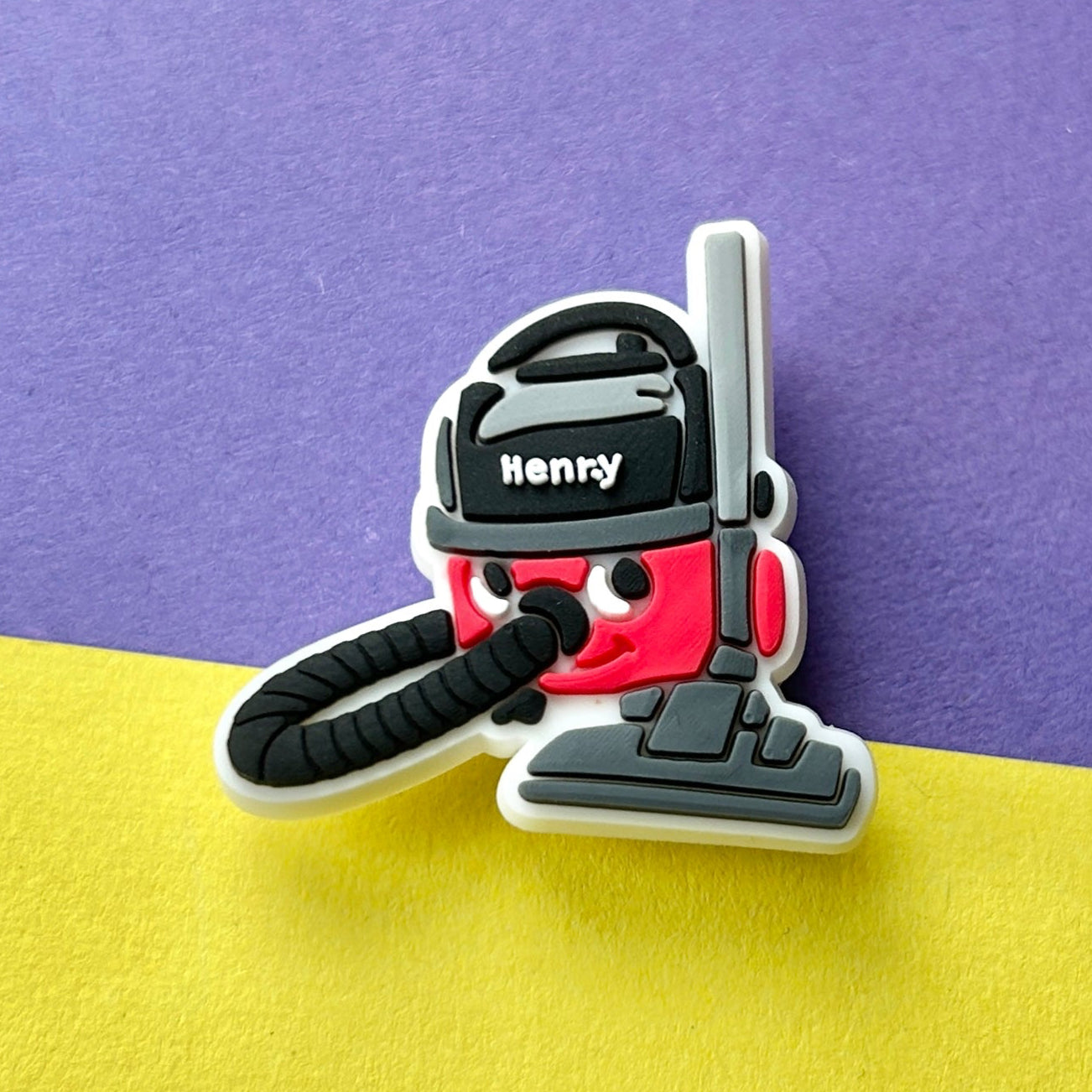 Red Vacuum Cleaner croc like shoe charm.