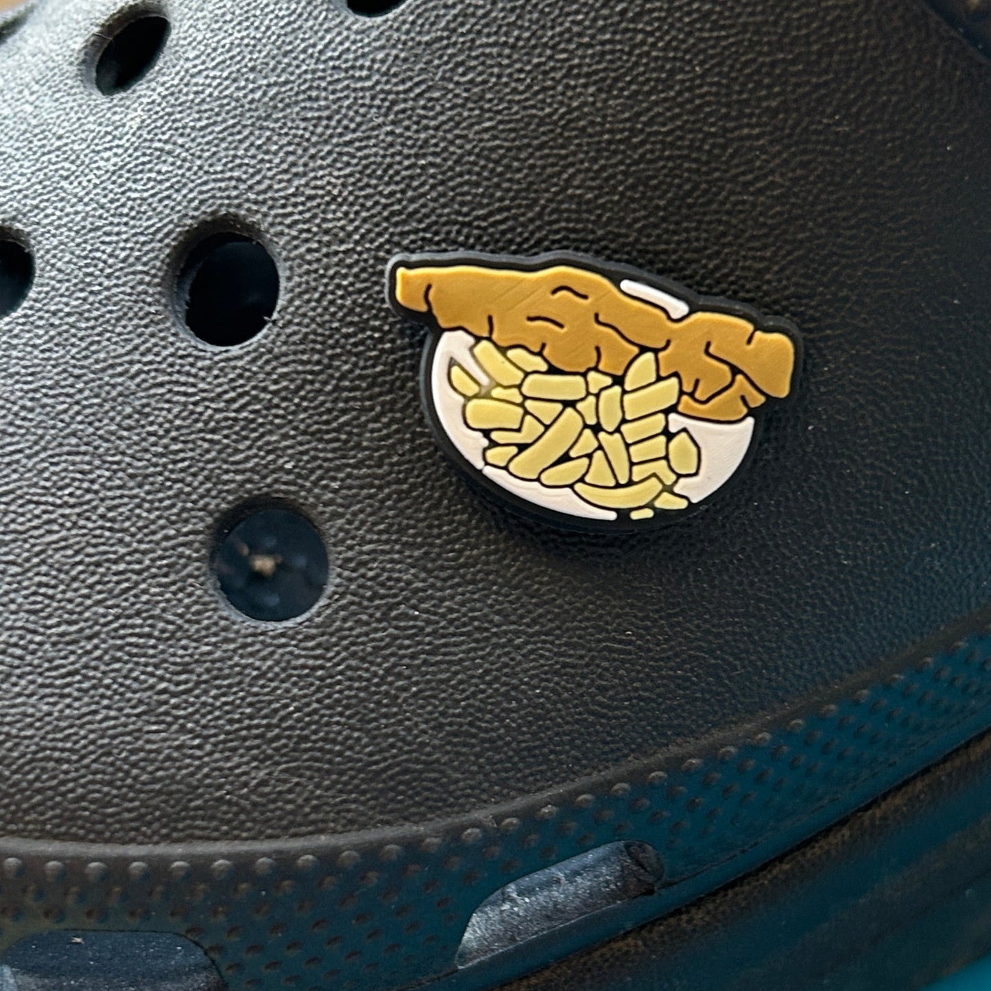 UK fave fish and chips croc shoe charm. Modelled on a black croc shoe.