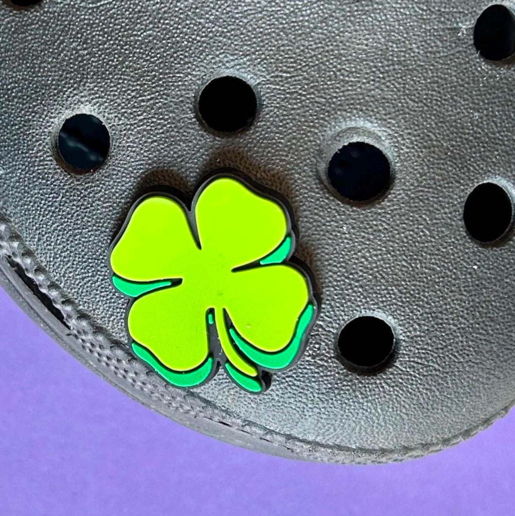 Green lucky four leaf clover croc like shoe charm. Modelled on a black croc shoe.
