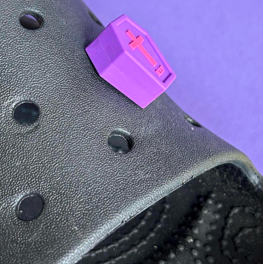 Purple 3D coffin shoe charm for crocs. Modelled on a shoe.