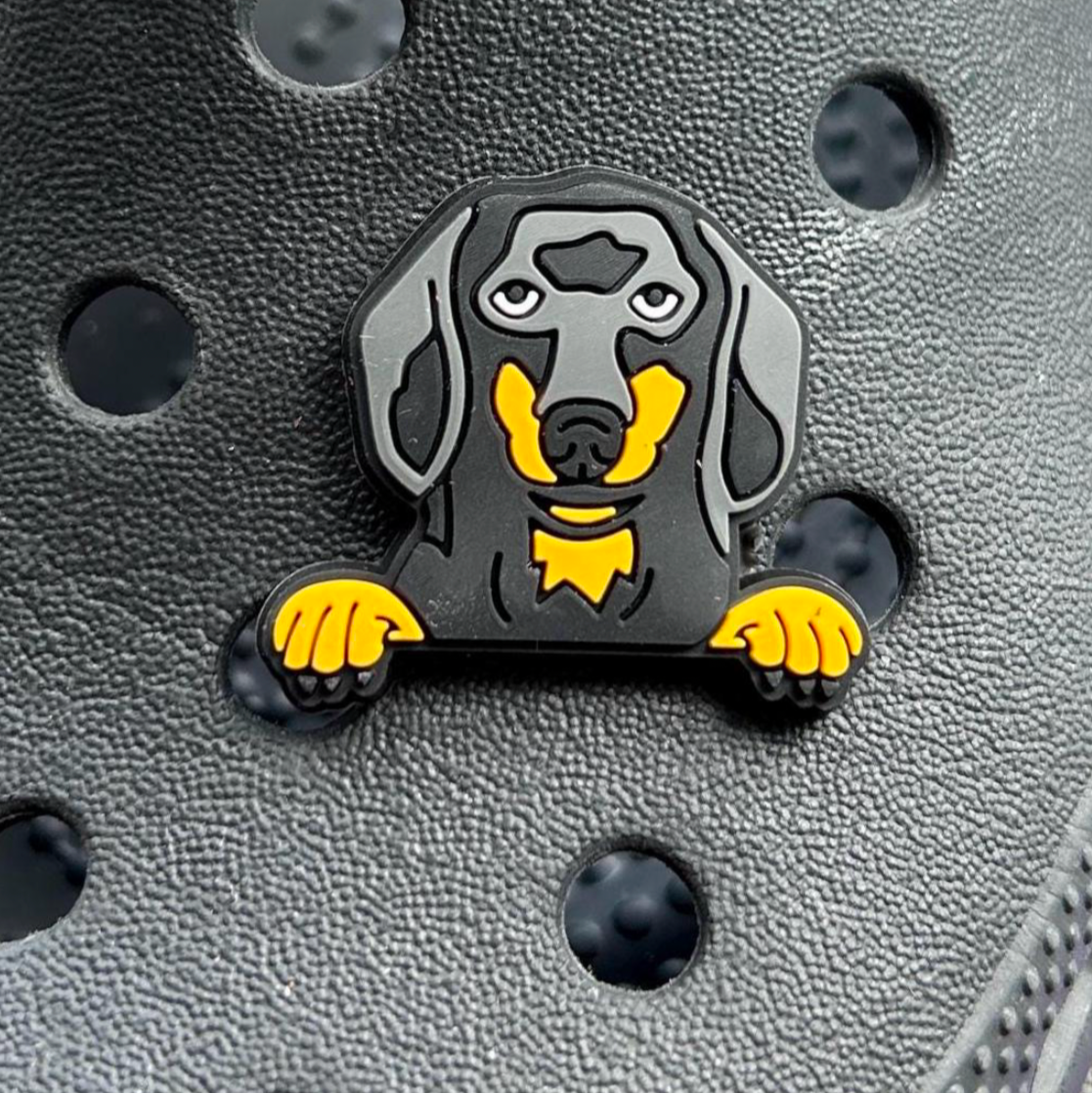 Black and Tan Dachshund Dog Face croc like shoe charm. Shown on a black croc shoe.