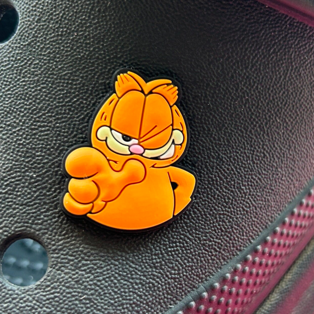 Winking Ginger Cat croc like shoe charm. Shown on a black croc shoe.