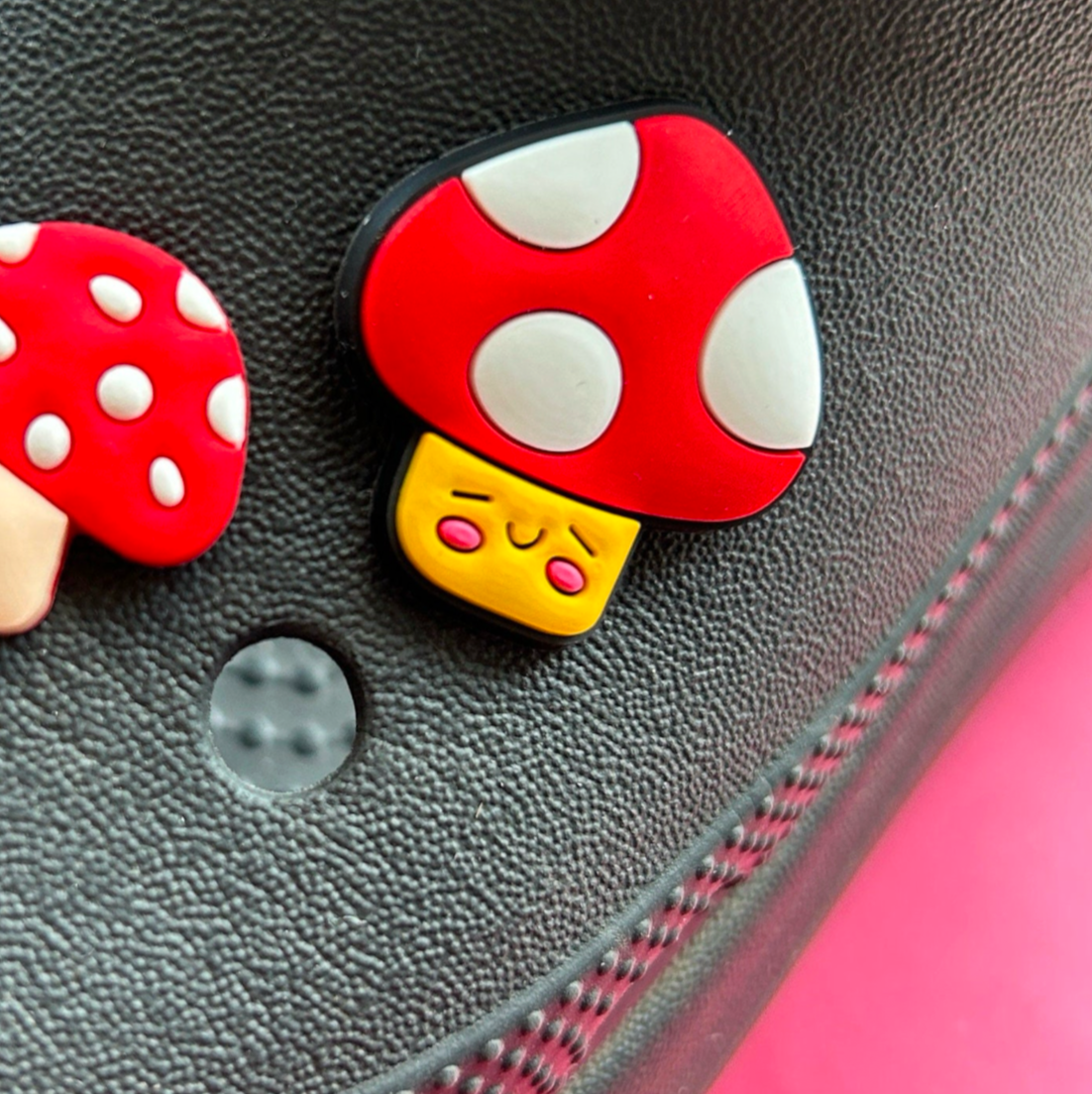 Large Smiley Happy Mushroom croc like shoe charm. Show on a black croc shoe.