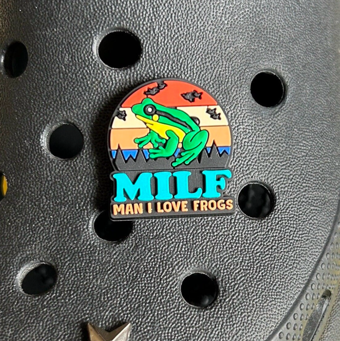 Funny MILF croc like shoe charm. Shown on a black croc shoe.