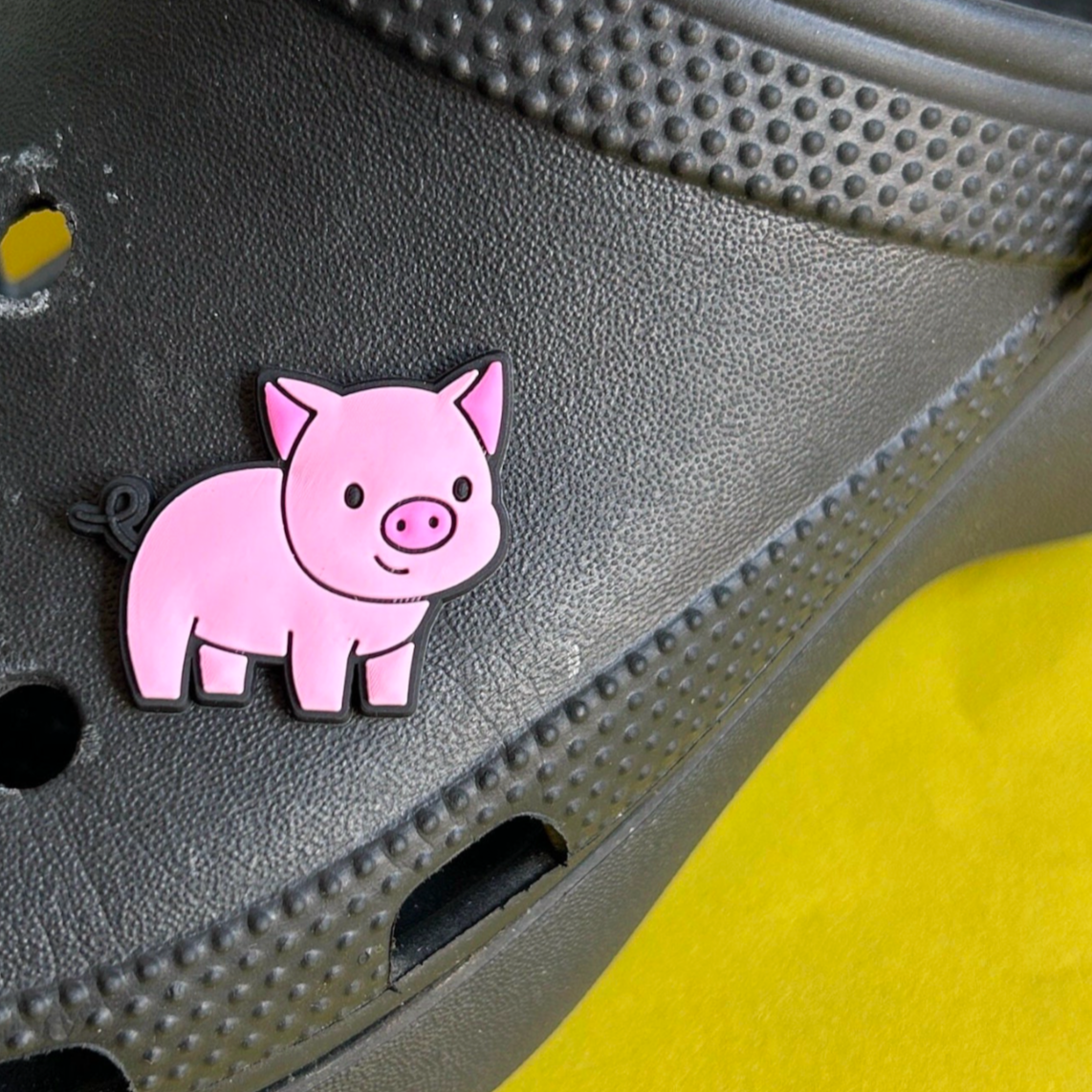 Cute Pig croc like shoe charm. Shown on a black croc shoe.
