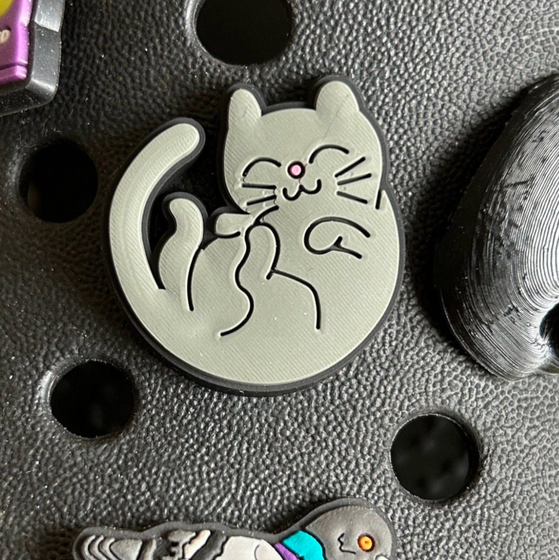 Cute Grey Cat croc like shoe charm. Shown on a black croc shoe.