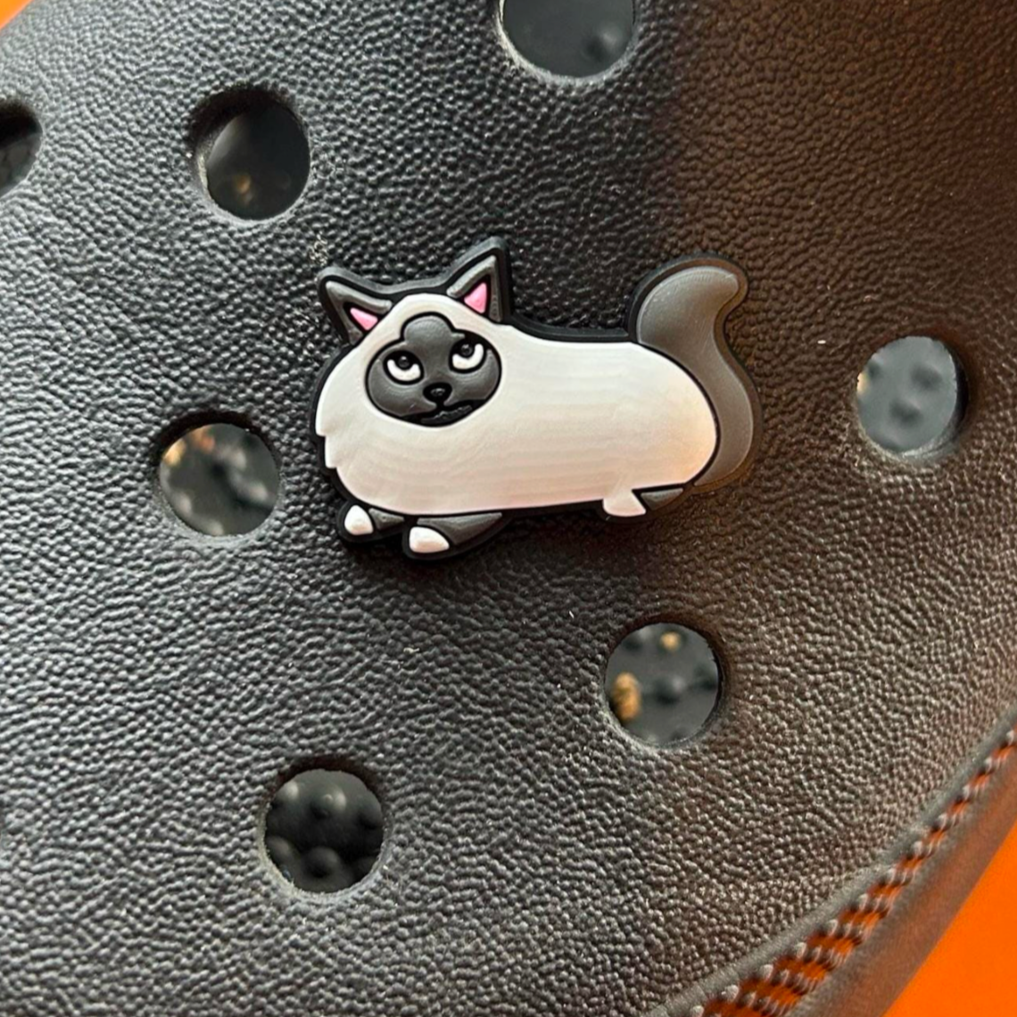Blue Point Cat croc like shoe charm. Shown on a black croc shoe.