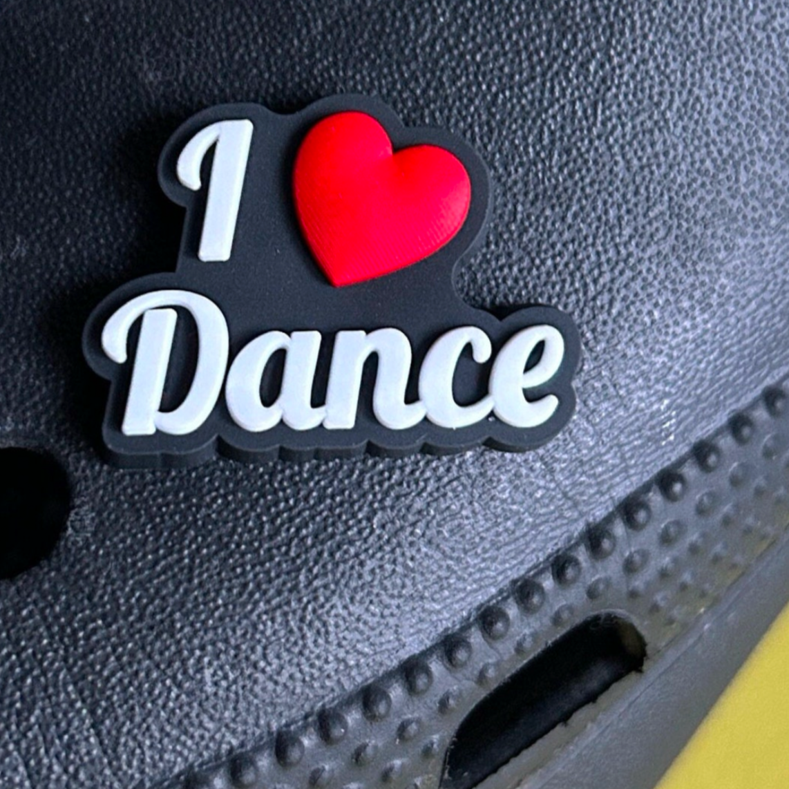 I Love Dance croc like shoe charm. Shown on a black croc shoe.