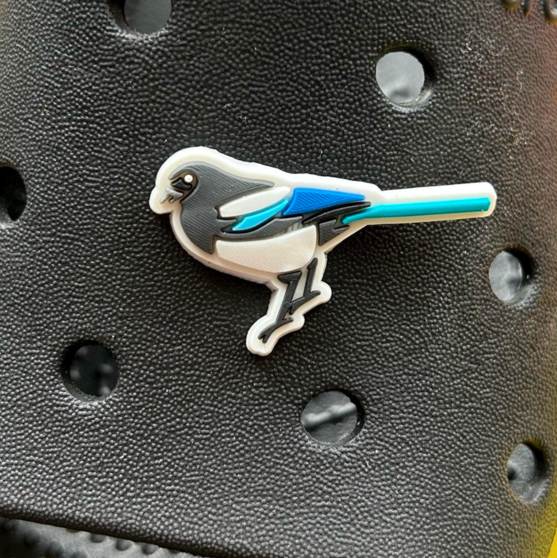 Magpie Bird croc like shoe charm. Shown on a black croc shoe.