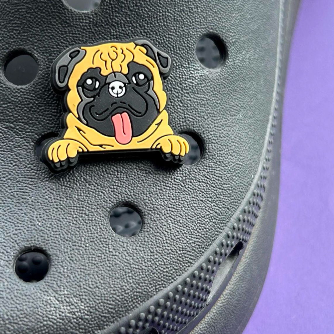 Pug Dog Face croc like shoe charm. Shown on a black croc shoe.