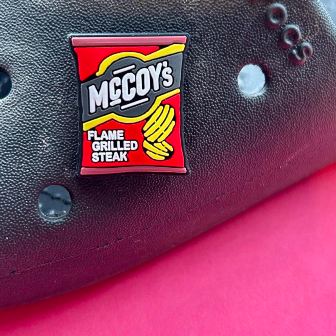Flame Grilled Steak Crisps croc like shoe charm. Shown on a black croc shoe.