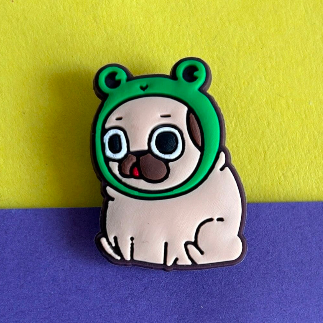 Pug Dog wearing a Frog Hat croc like shoe charm.