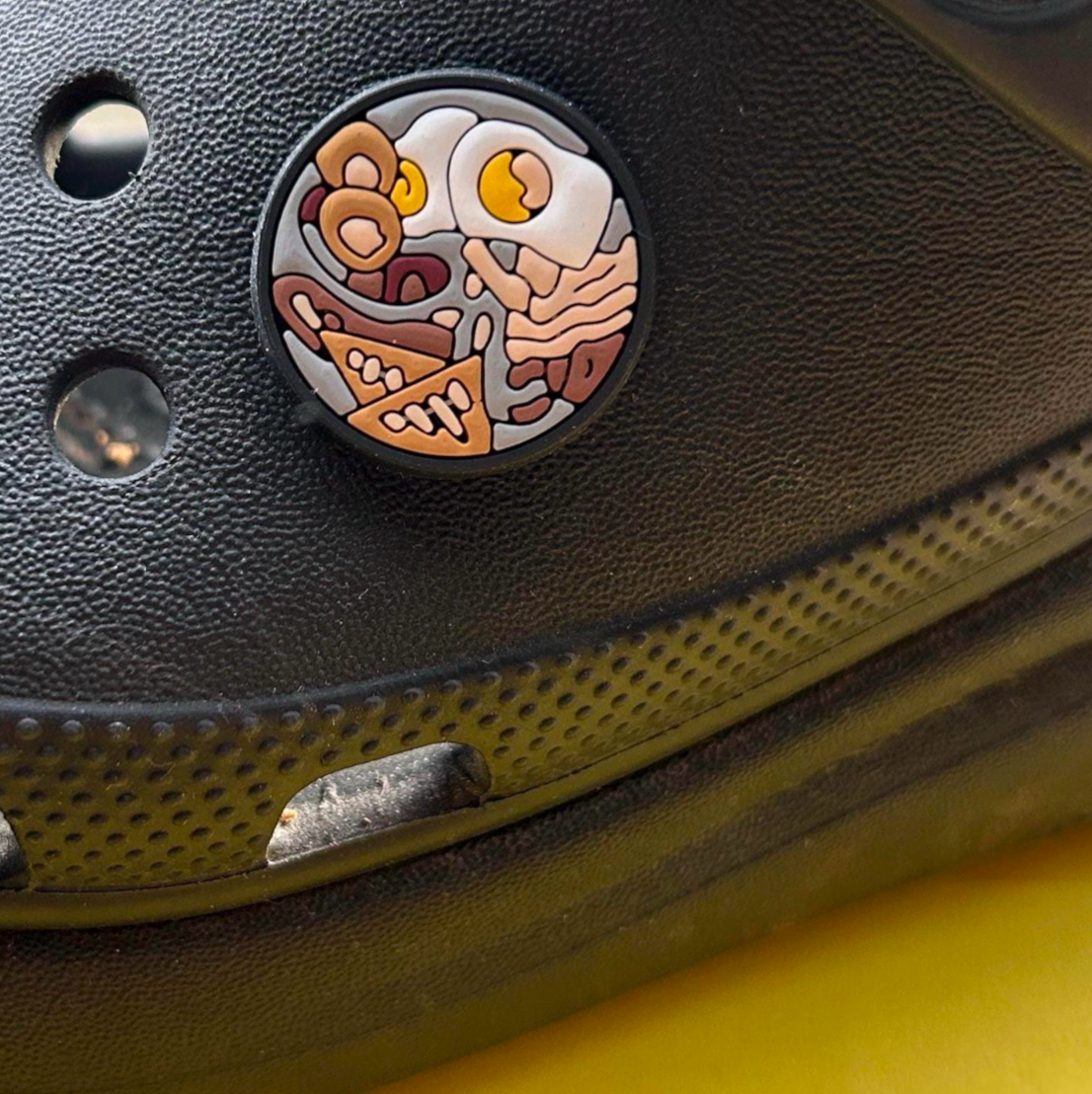 English Fry Up croc like shoe charm. Shown on a black croc shoe.