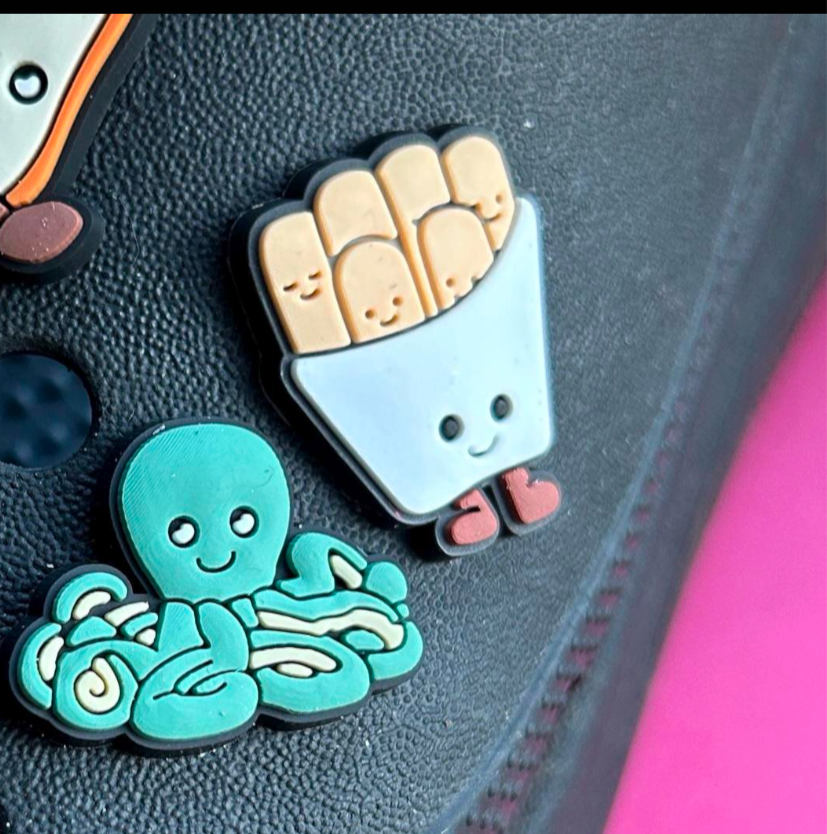 Happy Fries croc like shoe charm. Shown on a black croc shoe.