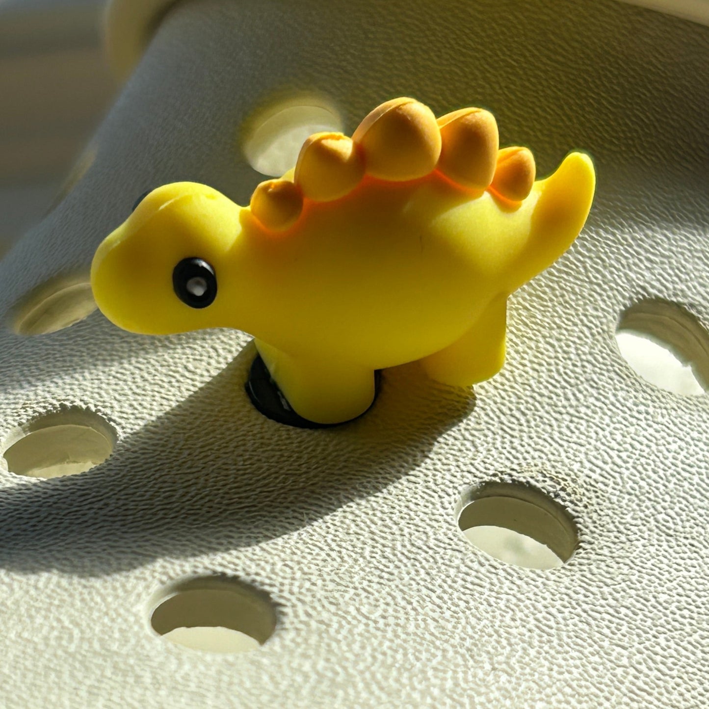 3D yellow dinosaur croc shoe charm. Modelled on a cream croc shoe.