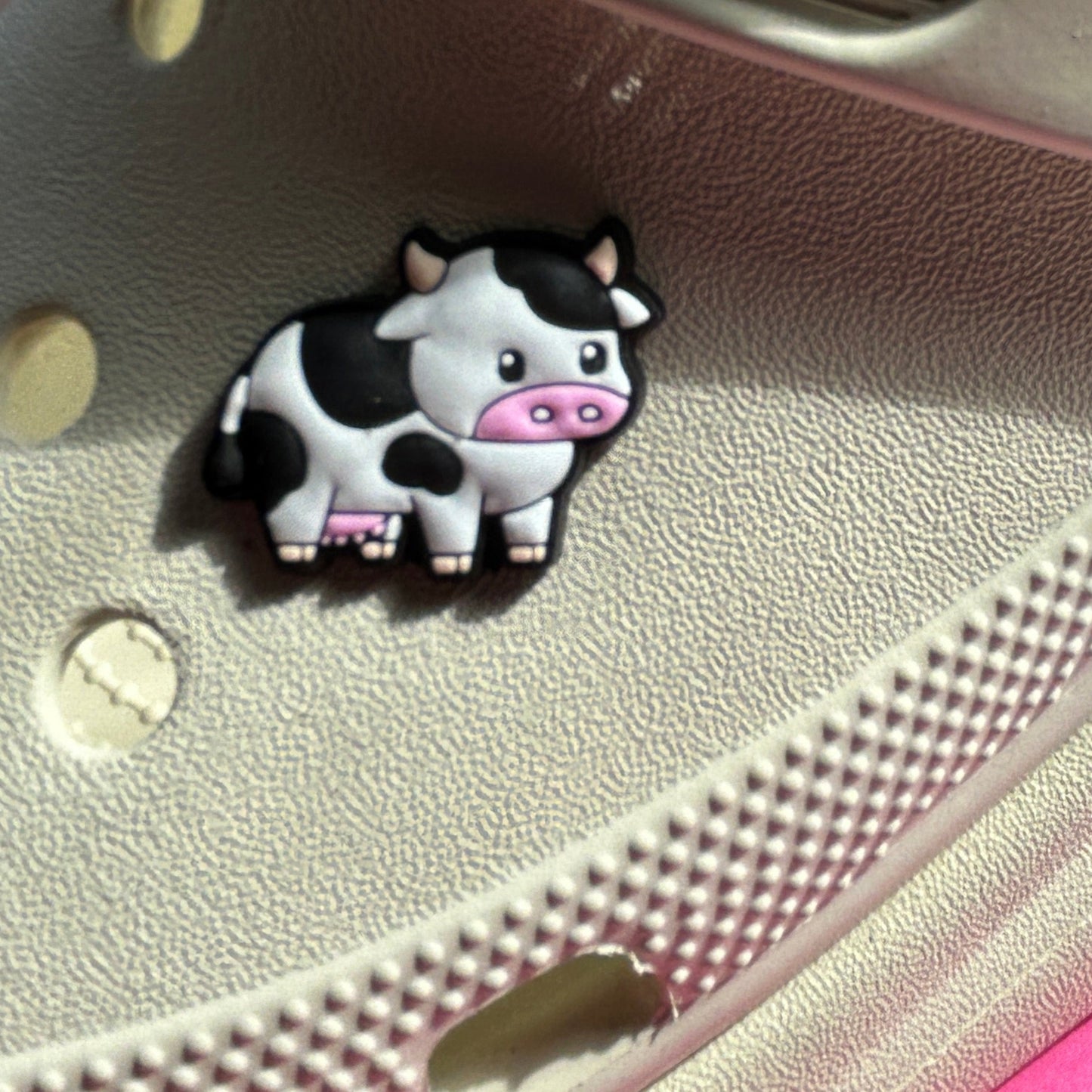 Black and white freesia cow croc shoe charm. Modelled on a cream croc shoe.