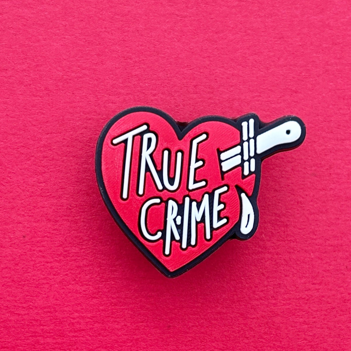 True Crime Lover Slogan croc like shoe charm. Red and White.