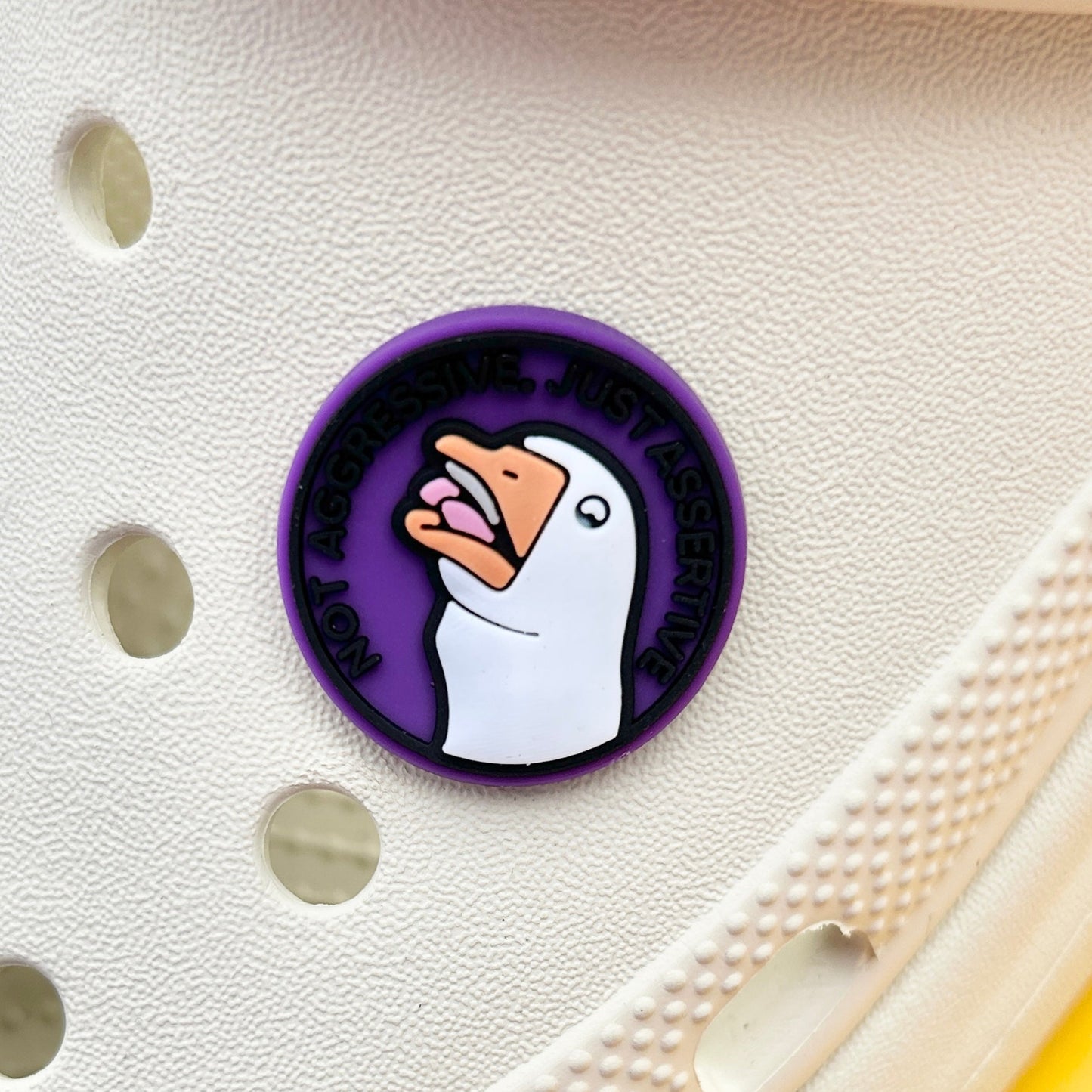 Purple, White and Black, Angry Goose - Assertive not Aggressive shoe charm. Shown on a cream croc shoe.