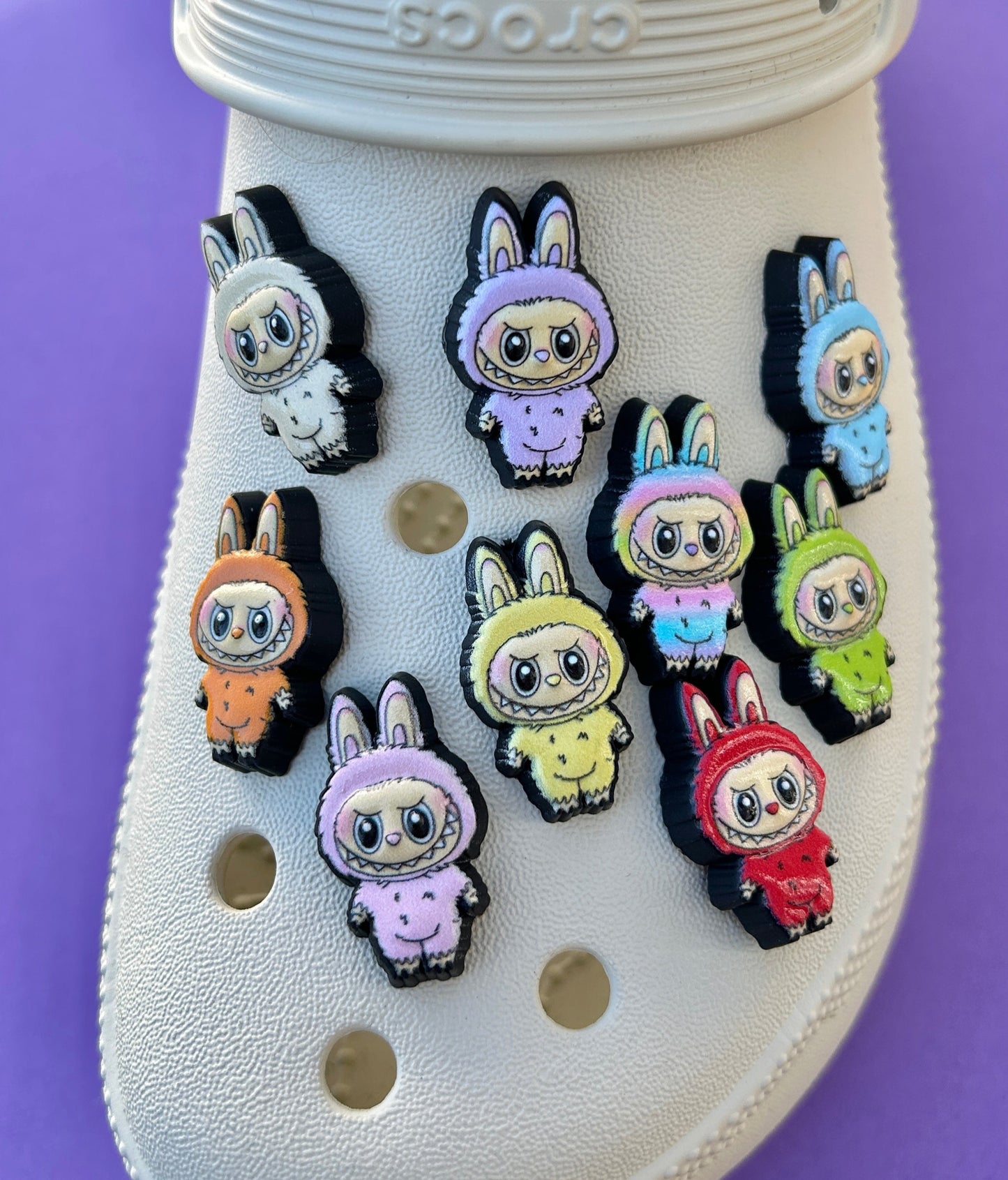 UV printed in the style of labubu croc charms shown on a croc shoe.
