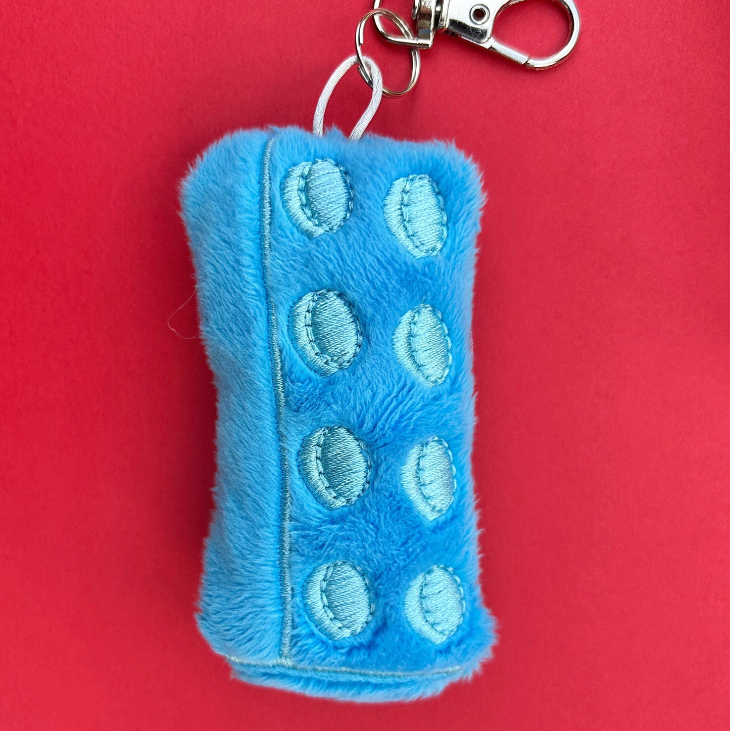 Soft plush brick keychain handmade accessory. Cyan blue.