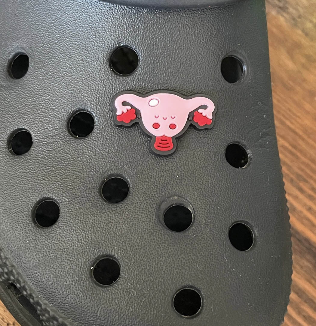 Female Reproductive Organs Shoe Charm on a croc shoe.