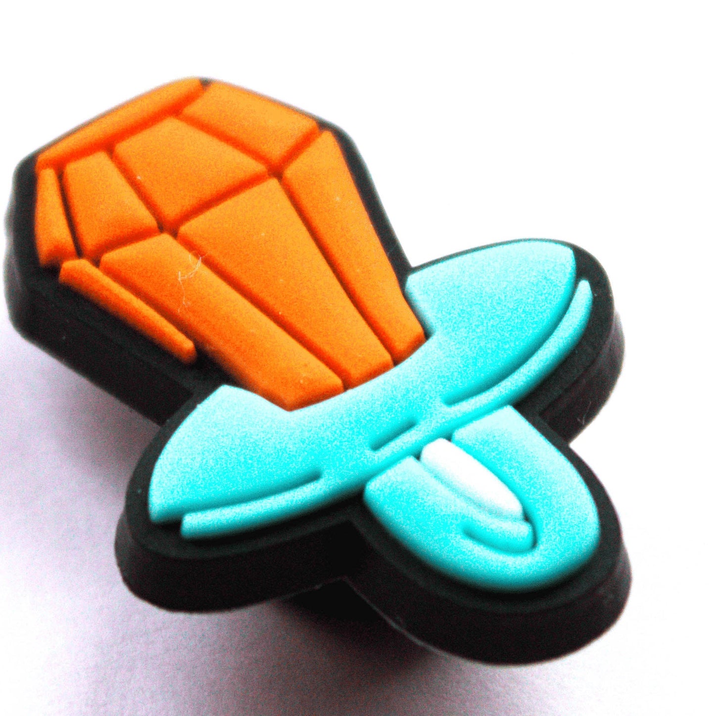 90's Ring Pop Dummy Sweet croc like shoe charm. Close up image. Blue and Orange.