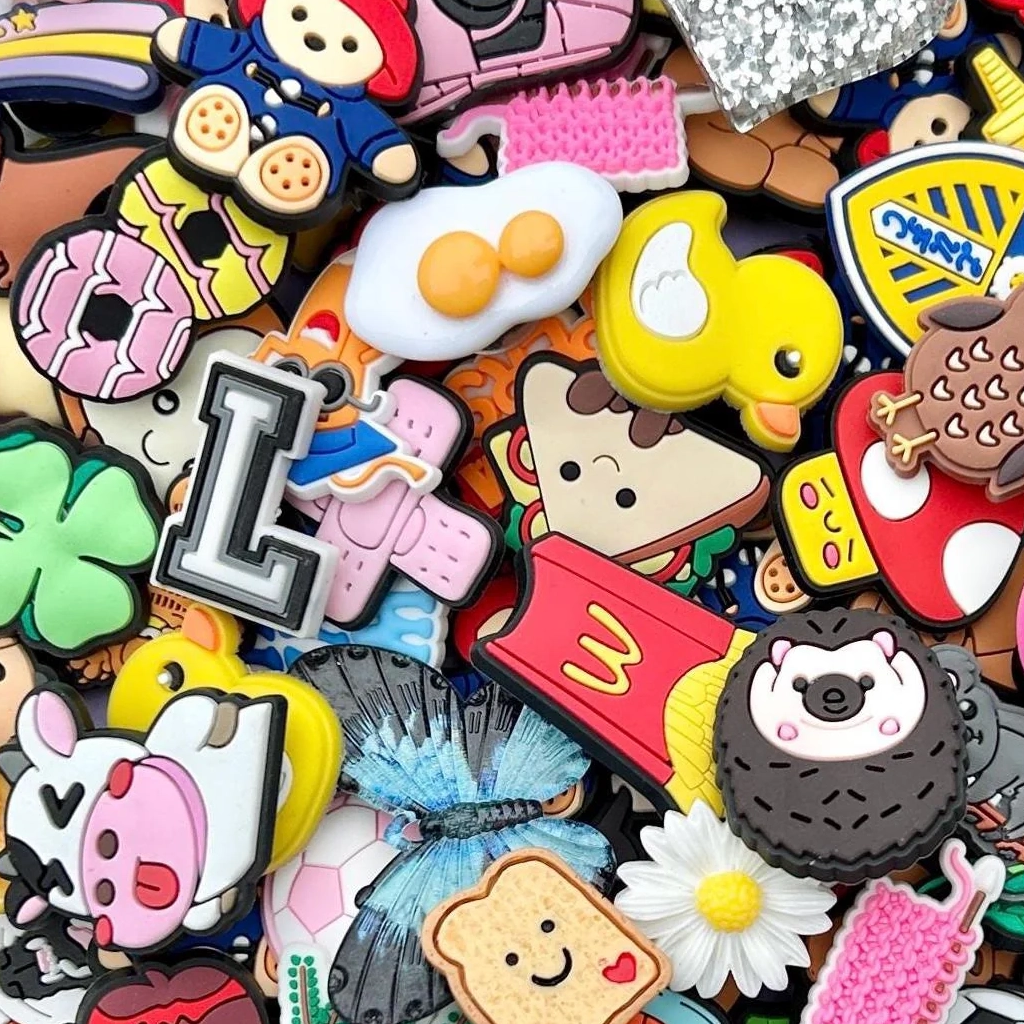 Brightly coloured image of lots of different croc shoe charms