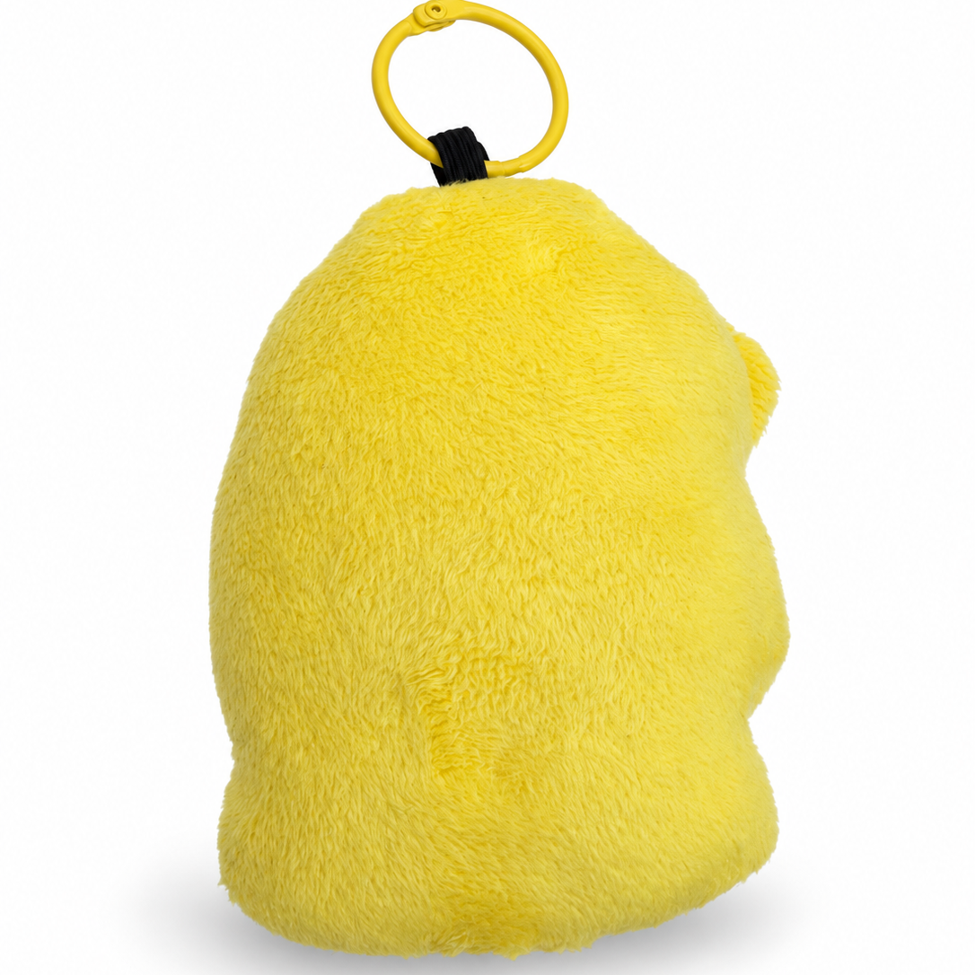A bright yellow plush toy shaped like a budgie, shown from the back with a yellow ring clip and black fastener, on a white background.