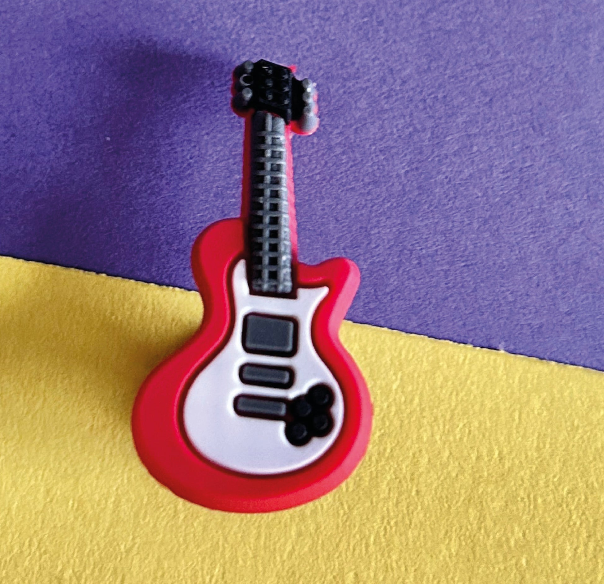 Red electric guitar croc like shoe charm. 